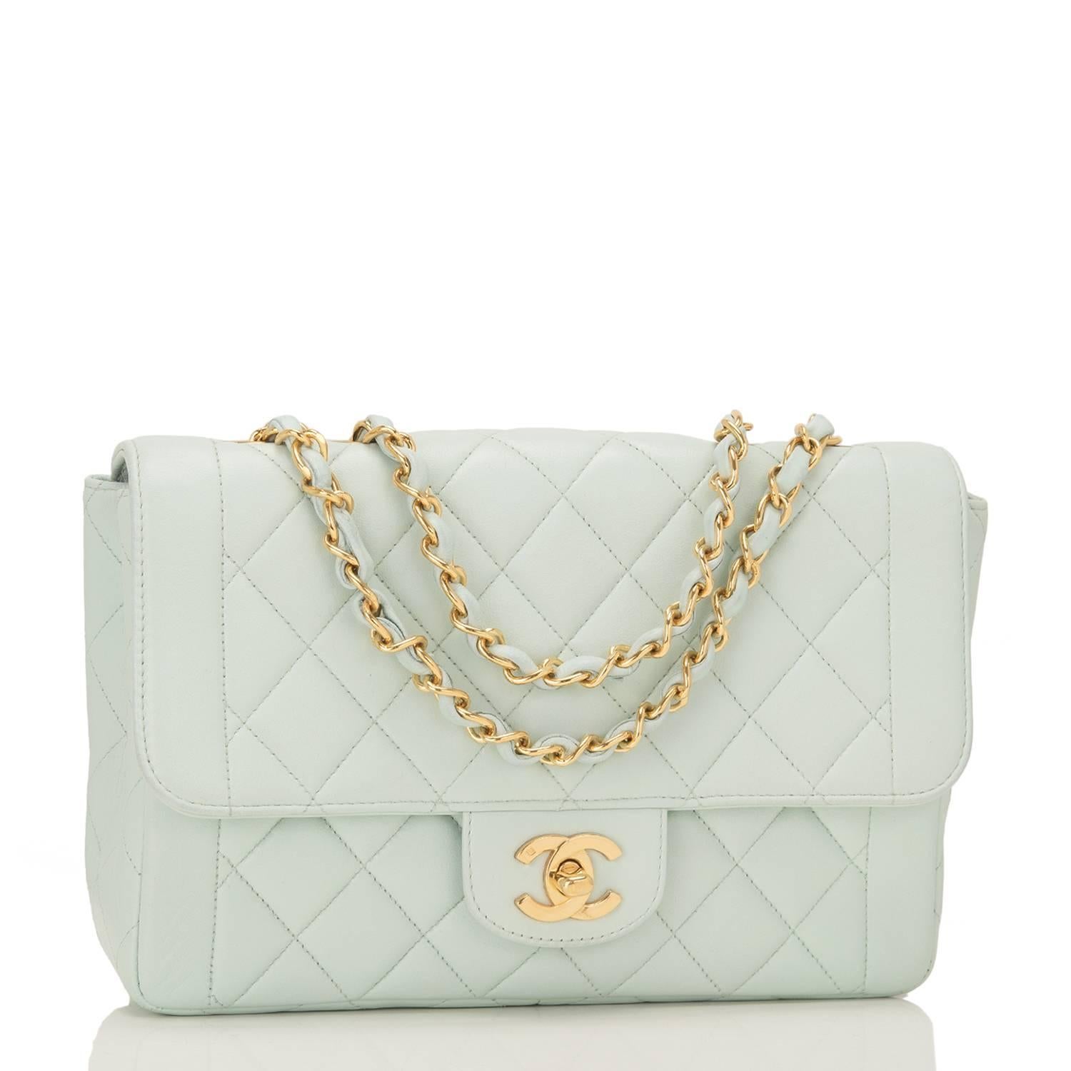 Chanel vintage flap bag of light turquoise lambskin leather with gold plated hardware.

This bag features a front flap with CC turnlock closure and an interwoven gold plated chain link and turquoise leather shoulder strap.

The interior is lined
