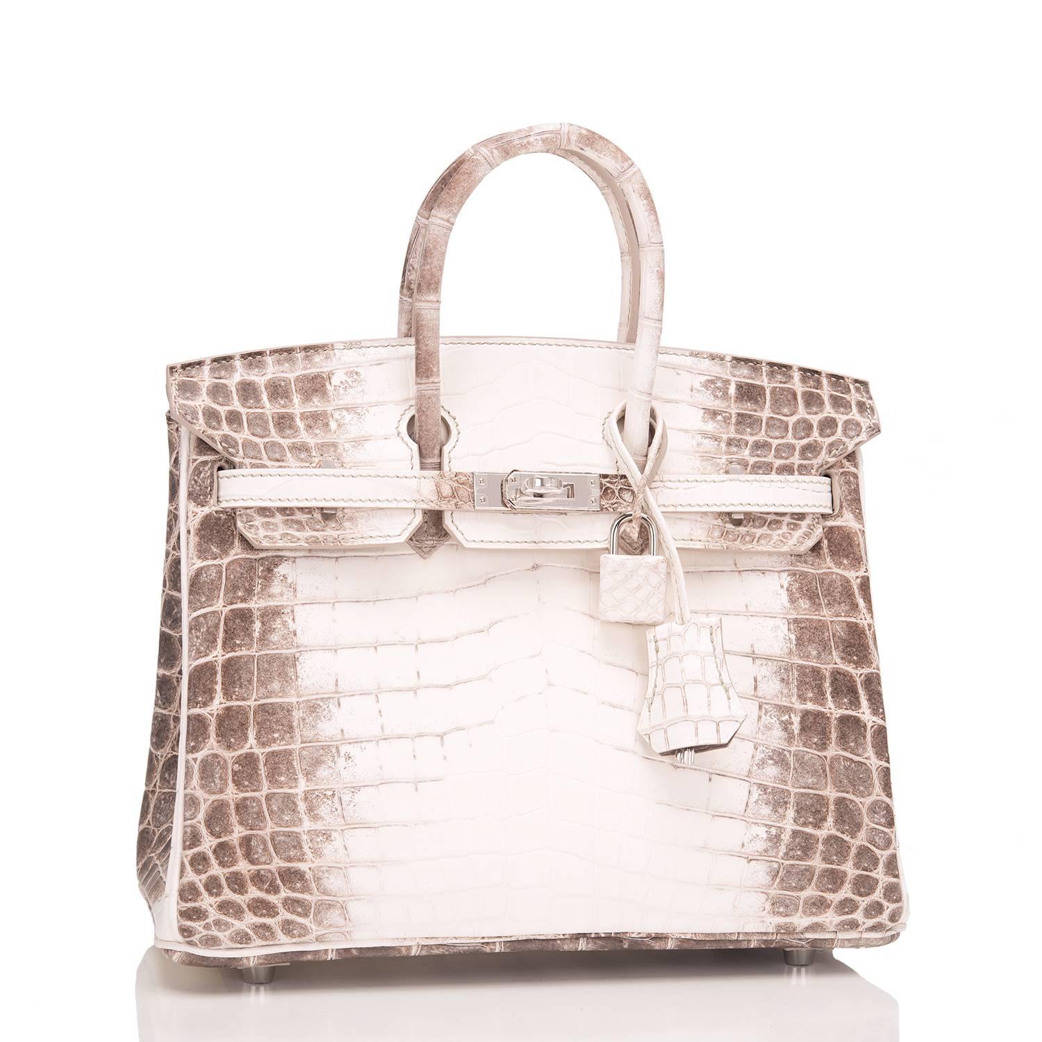 Hermes Himalayan 25cm Birkin of white matte niloticus crocodile skin with palladium hardware.

This rare Himalayan, dyed to resemble the Himalayan mountains, features tonal stitching, a front toggle closure, a clochette with lock and two keys, and