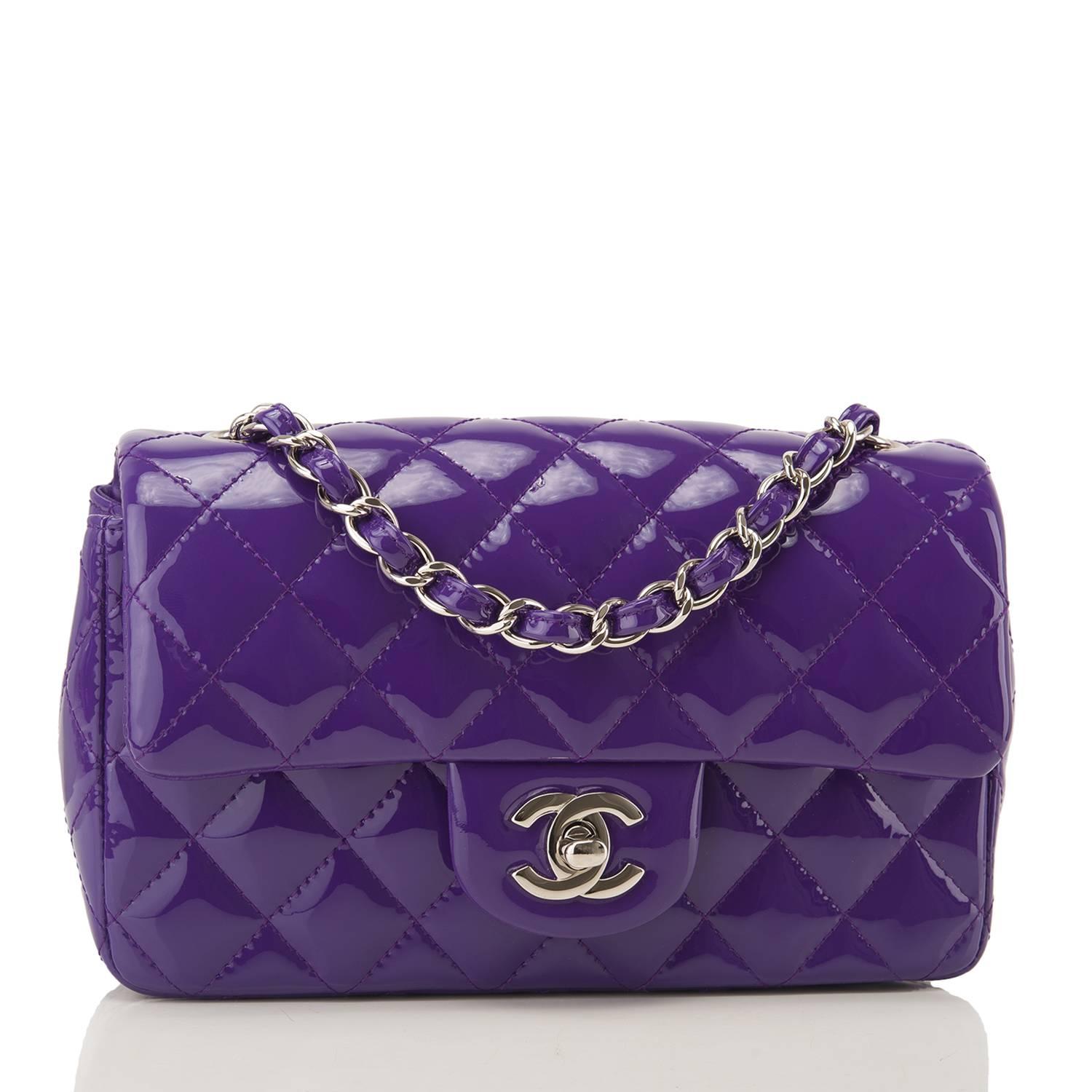 Chanel Rectangular Mini Classic flap bag of purple patent leather with silver tone hardware.

This bag has a front flap with signature CC turnlock closure, rear half moon pocket and single interwoven purple leather and silver tone chain link