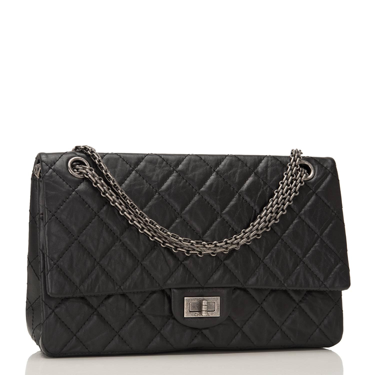 Chanel black quilted aged calfskin leather Reissue 2.55 double flap size 255 with aged ruthenium hardware.

This bag has a front flap with CC turn lock closure, burgundy leather interior, half moon back pocket and adjustable ruthenium bijoux chain
