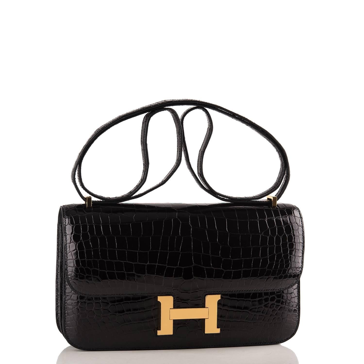 Hermes Black Constance Elan 25cm in porosus crocodile with gold hardware.

This classic Hermes style features tonal stitching, gold hardware, a metal 