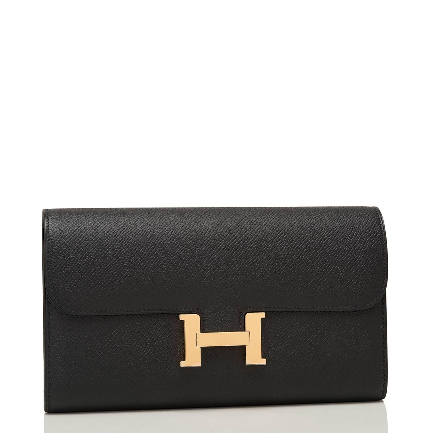 Hermes Constance Long wallet/clutch of black epsom leather with gold hardware.

This wallet, which can also be worn as a clutch,  has tonal stitching, a metal 