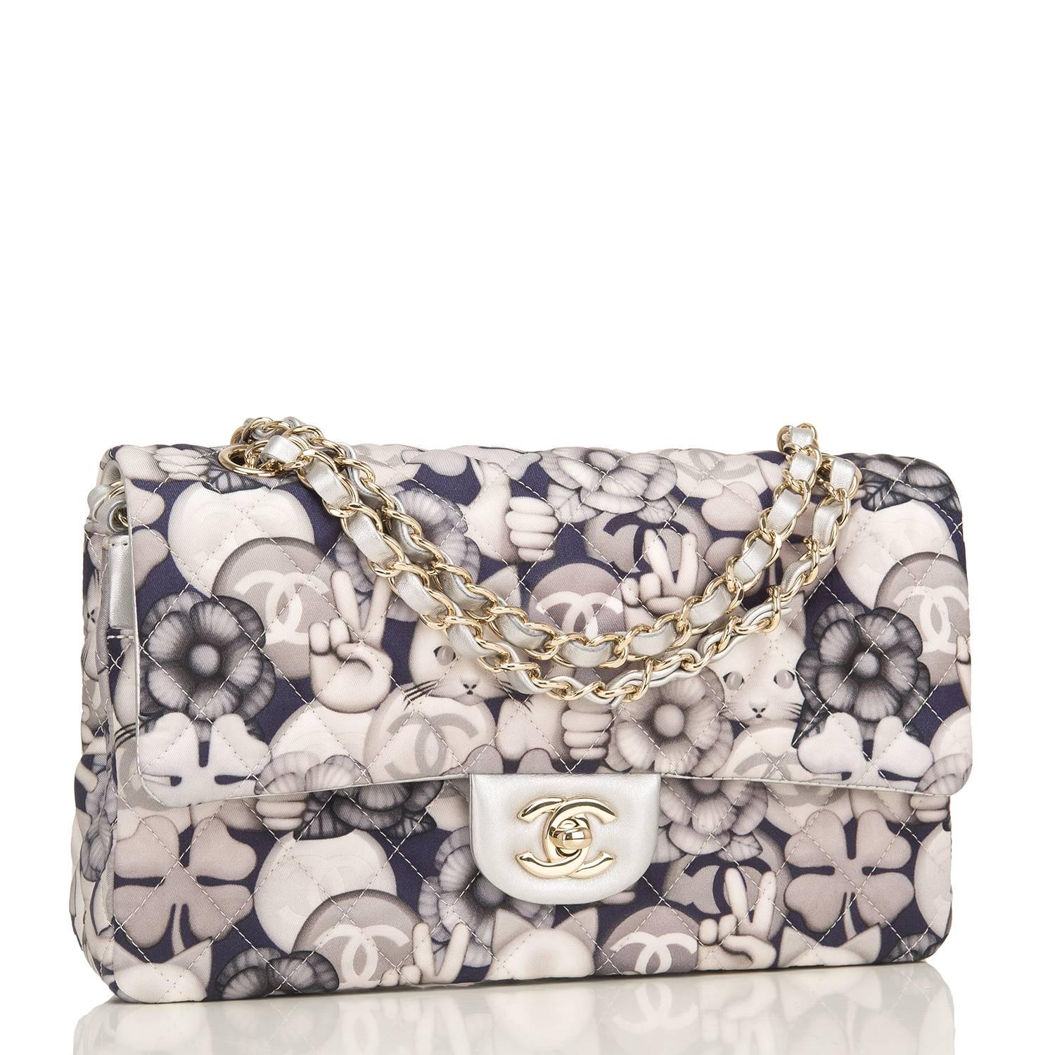 Chanel CC, Peace, Cat graphic printed quilted fabric and leather Classic Medium double flap bag of grey, navy and silver with silver leather and gold tone hardware.

This runway bag has a printed design of cats, camellias, CCs, peace signs, and