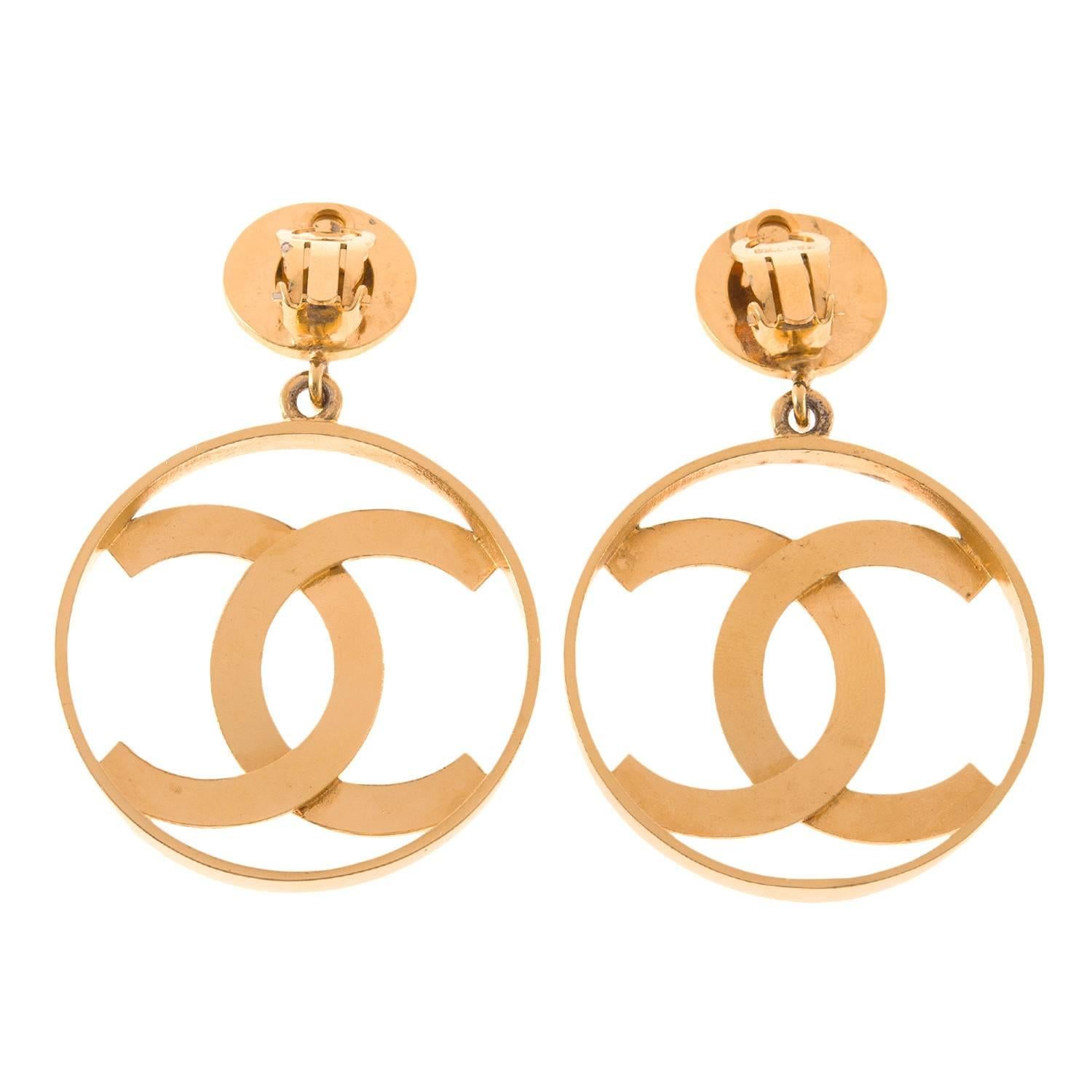 Chanel large vintage CC-logo hoop clip-on earrings of gold tone metal.

These rare earrings are large round hoops with Chanel's iconic CC-logos inside attached to disc earclips. 

Collection: Vintage

Condition: Vintage; excellent. The gold