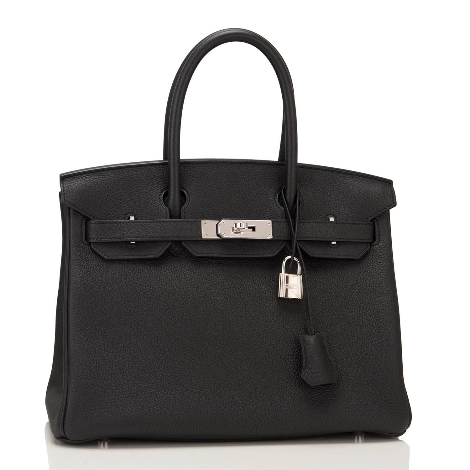 Hermes Black Birkin 30cm of togo leather with palladium hardware.

This Birkin features tonal stitching, a front toggle closure, a clochette with lock and two keys, and double rolled handles.

The interior is lined with black chevre and has one