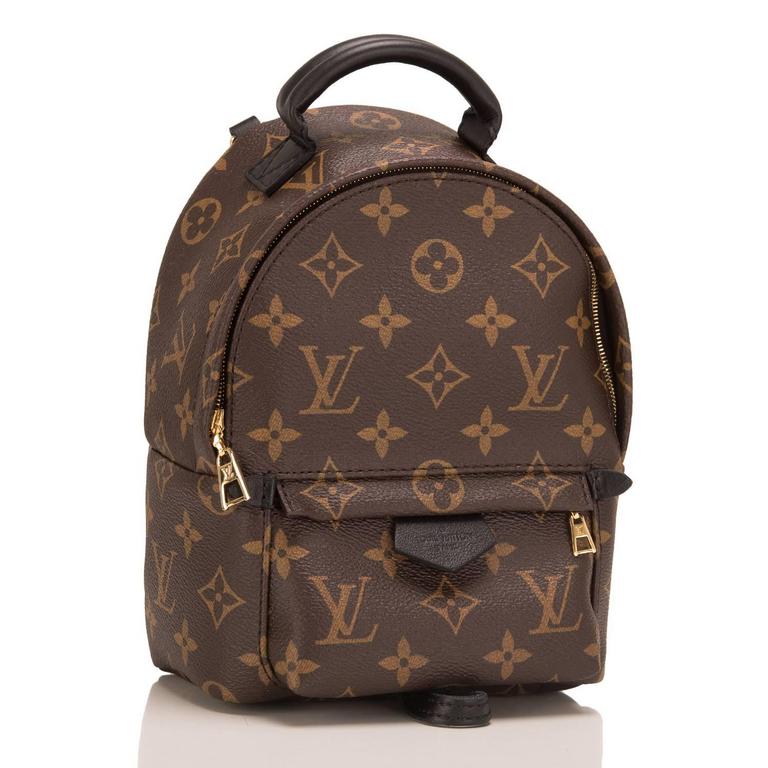 Louis Vuitton Monogram Palm Springs Backpack Mini designed by Nicholas Ghesquiere with golden brass hardware.

The Monogram coated canvas has a soft calfskin trim, leather scarf loop, two adjustable shoulder straps, golden brass and black leather