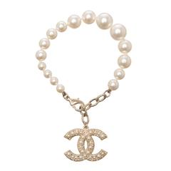 Chanel Gold Tone Faux Pearl Bracelet With Dangling CC Charm
