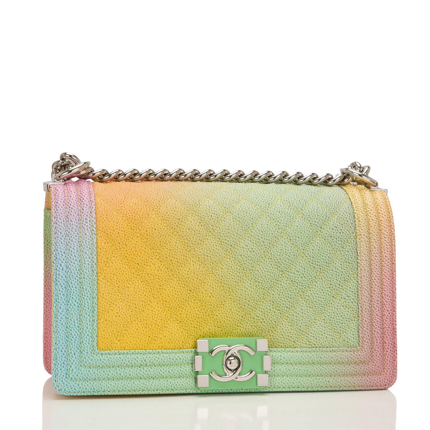 Chanel Old Medium Boy bag of rainbow printed caviar leather with silver tone hardware.

This limited edition bag from the Cuba collection features a full front flap with the Le Boy CC push lock closure of green resin and silver tone hardware and a