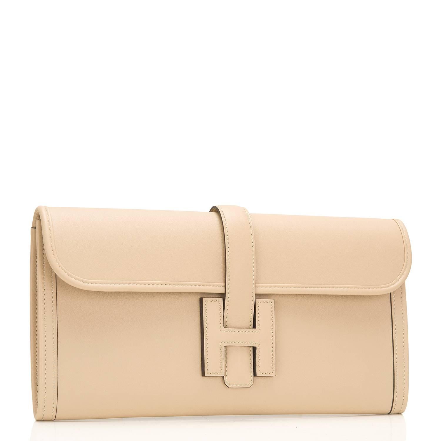 Hermes Trench Jige Elan clutch 29cm of swift leather. 

This Jige clutch has tonal stitching and front 