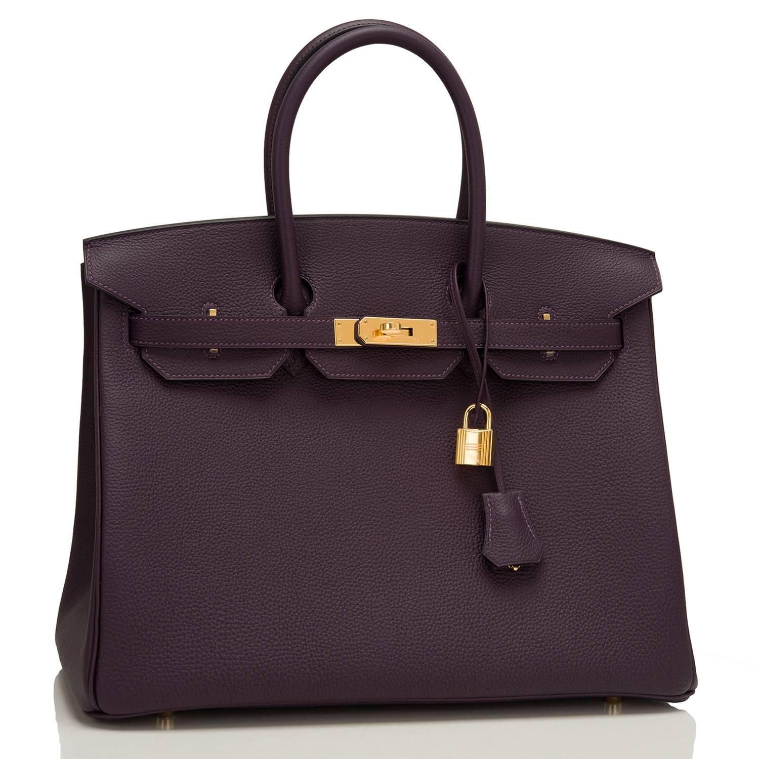 Hermes Raisin Birkin 35cm of togo with gold hardware.

This Birkin has a front toggle closure, a clochette with lock and two keys, and double rolled handles.

The interior is lined with Raisin chevre and has one zip pocket with an Hermes
