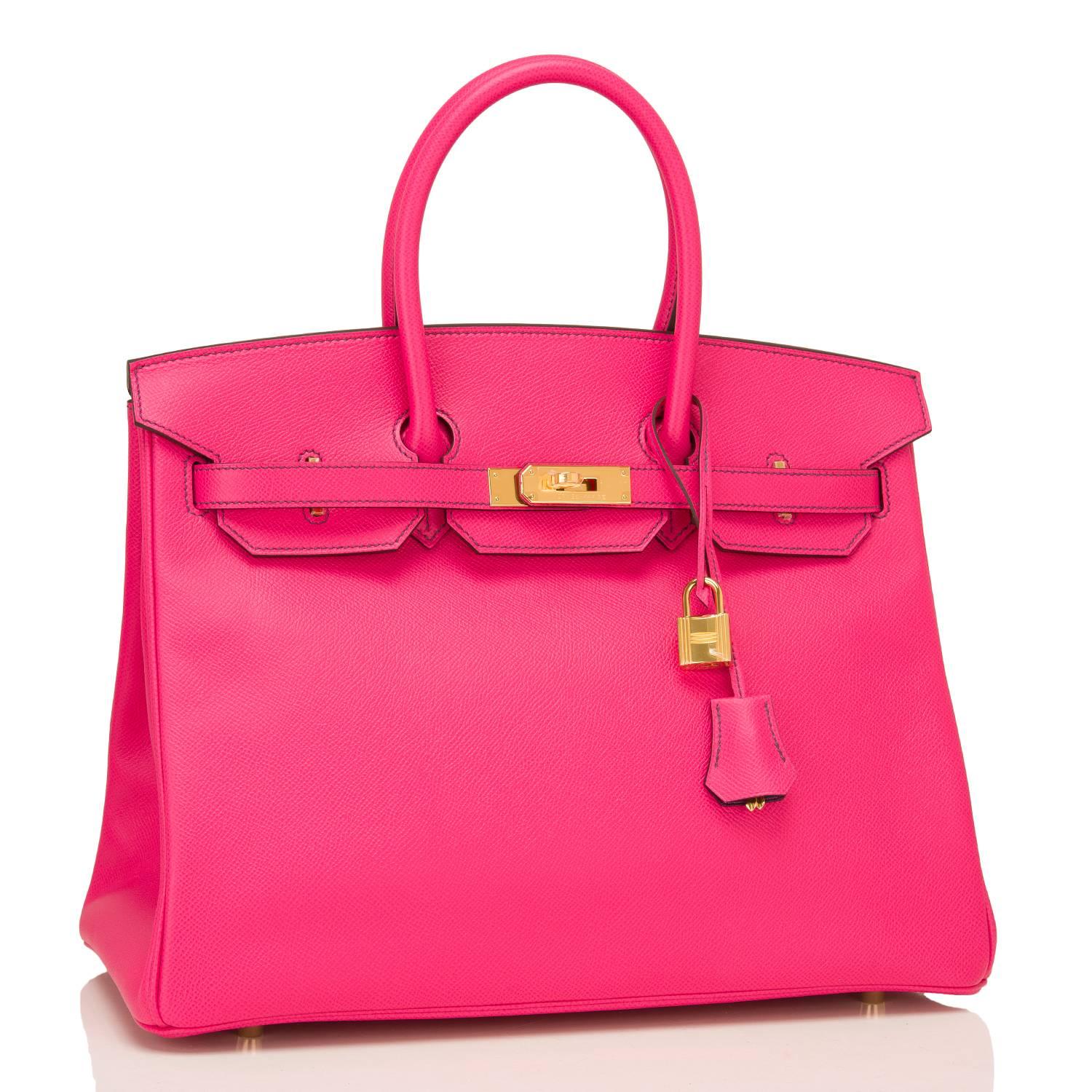 Hermes special order bi-color Birkin 35cm of Rose Tyrien epsom leather with Crocus interior accented with gold hardware.

This pink epsom Birkin has Crocus contrast stitching, front toggle closure, clochette with lock and two keys, and double