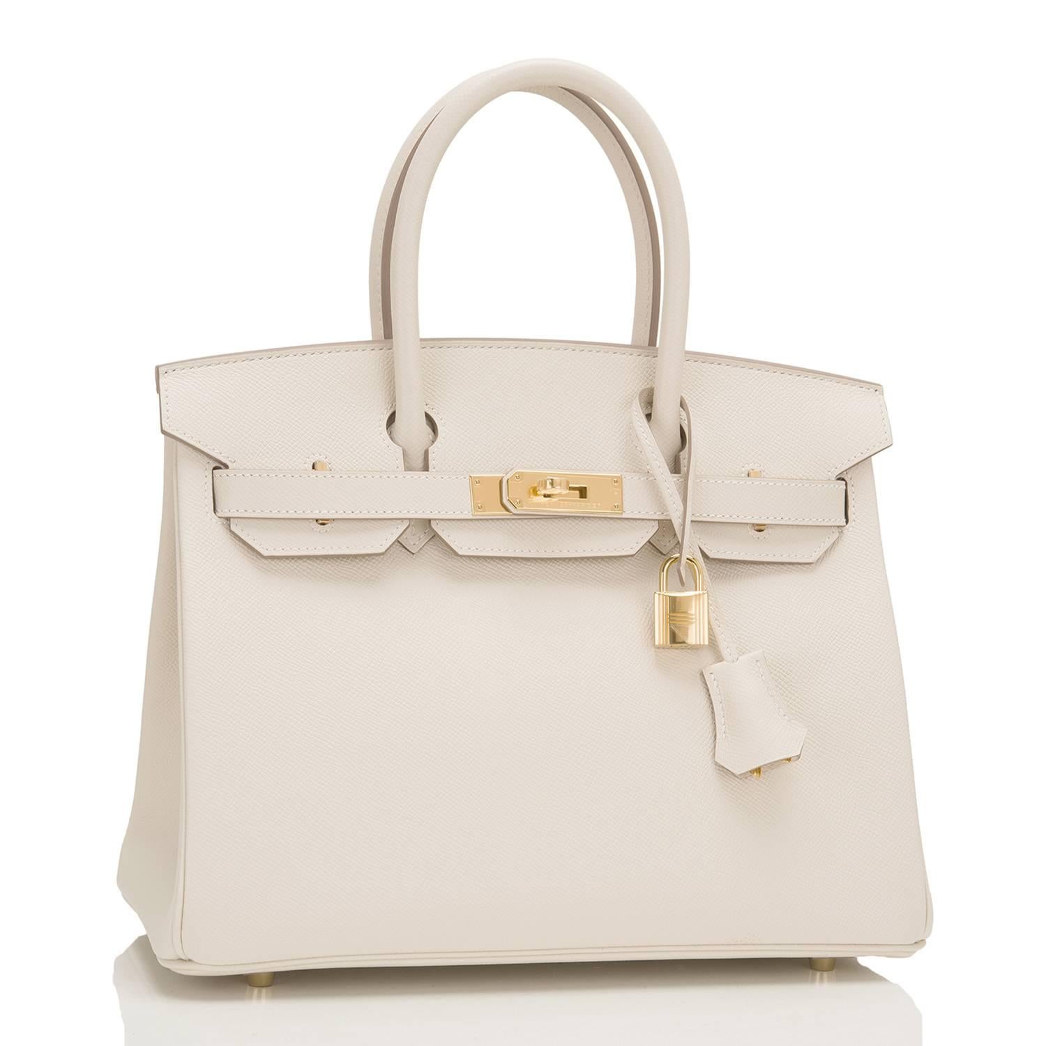 Hermes Craie Birkin 30cm of epsom leather with gold hardware.

This Birkin features tonal stitching, a front toggle closure, a clochette with lock and two keys, and double rolled handles.

The interior is lined with Craie chevre and has one zip