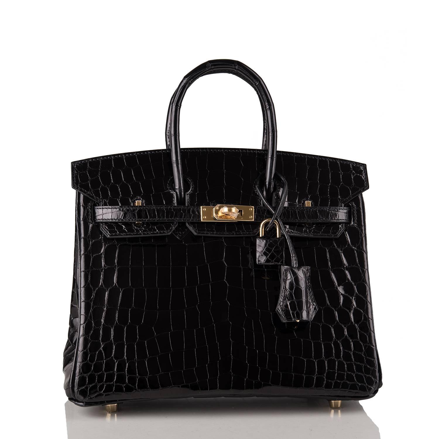 Hermes Black Birkin 25cm of shiny Niloticus crocodile with gold hardware.

This Birkin has tonal stitching, a front toggle closure, a clochette with lock and two keys, and double rolled handles.

The interior is lined with Black chevre and has one
