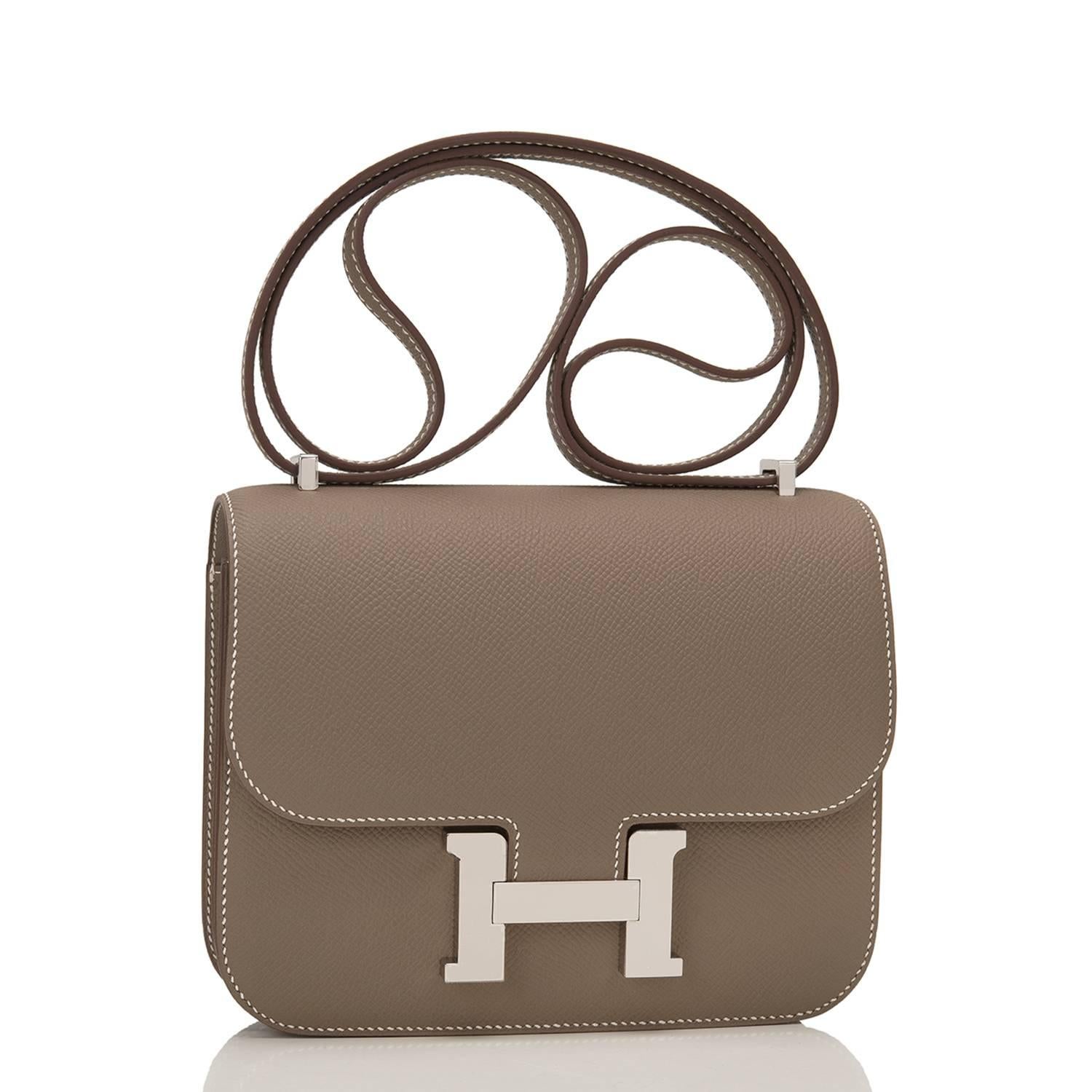 Hermes Etoupe Mini Constance 18cm of epsom leather with palladium hardware.

This Constance has contrast stitching, a metal