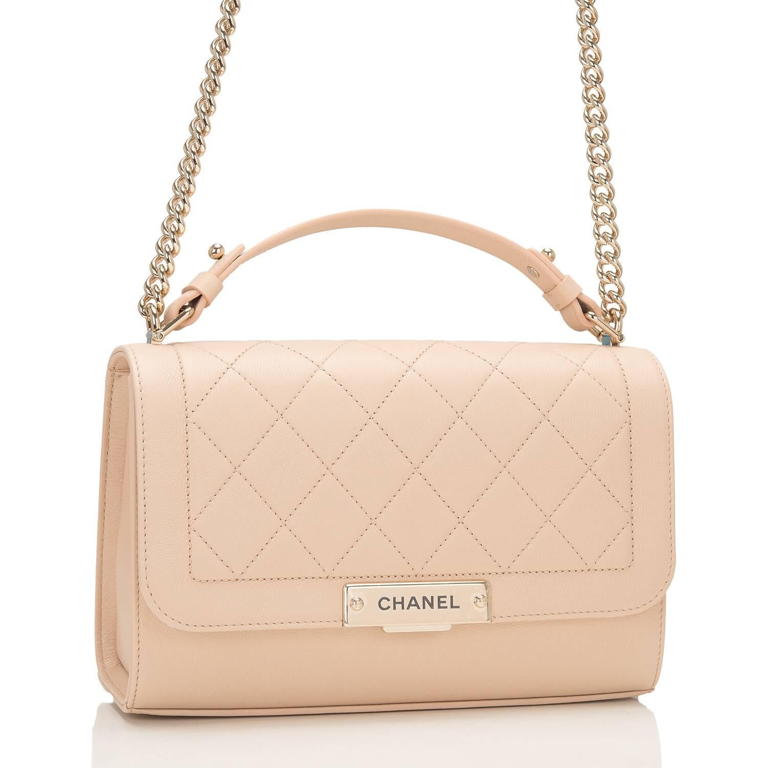 Chanel Medium Label Click Flap bag of quilted and smooth light 