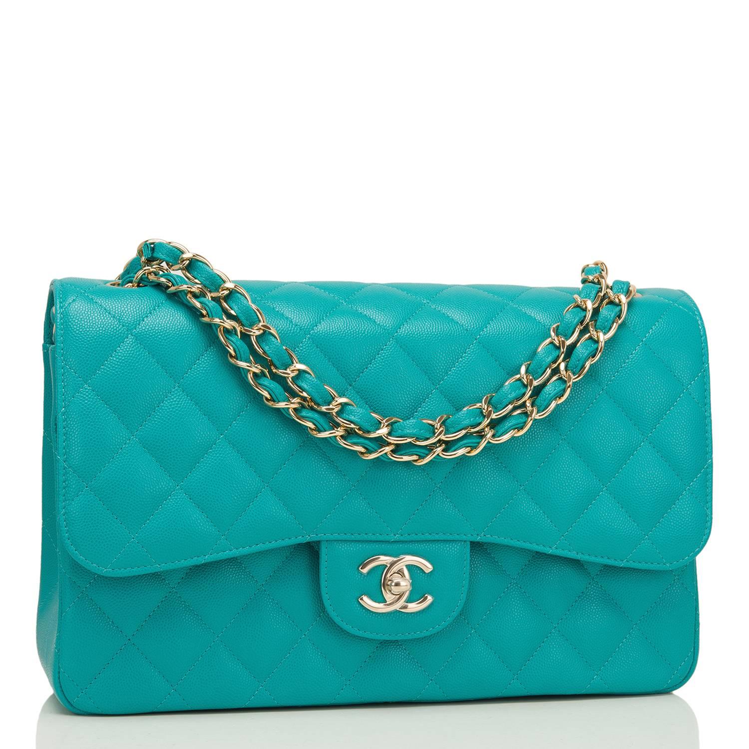 Chanel Jumbo Classic double flap bag of turquoise quilted caviar leather and accented with light gold tone hardware.

The bag features a front flap with signature CC turnlock closure, a half moon back pocket, and an adjustable interwoven light gold