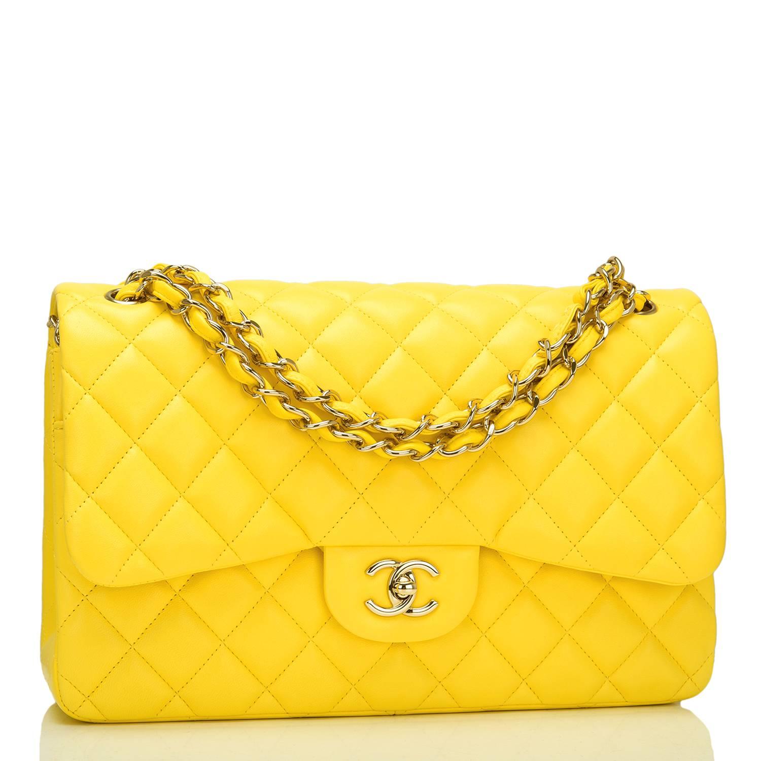 Chanel Jumbo Classic double flap bag of yellow quilted lambskin leather and accented with gold tone hardware.

The bag features a front flap with signature CC turnlock closure, a half moon back pocket, and an adjustable interwoven gold tone chain