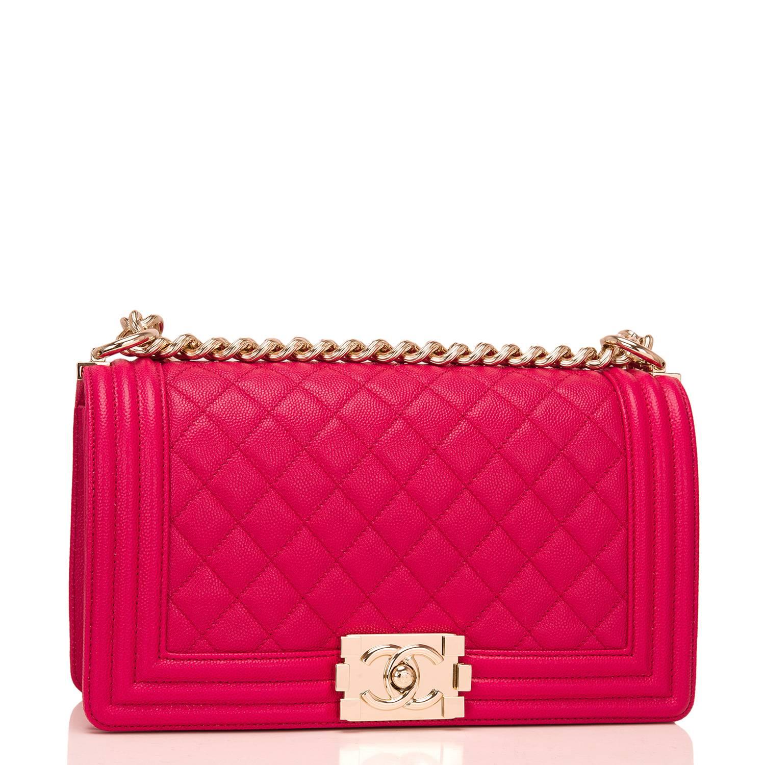 Chanel Old Medium Boy bag of fuchsia quilted caviar leather and light gold tone hardware.

This Chanel bag is in the classic Boy style with a full front flap with the Boy signature CC push lock closure, smooth leather trim and light gold tone chain