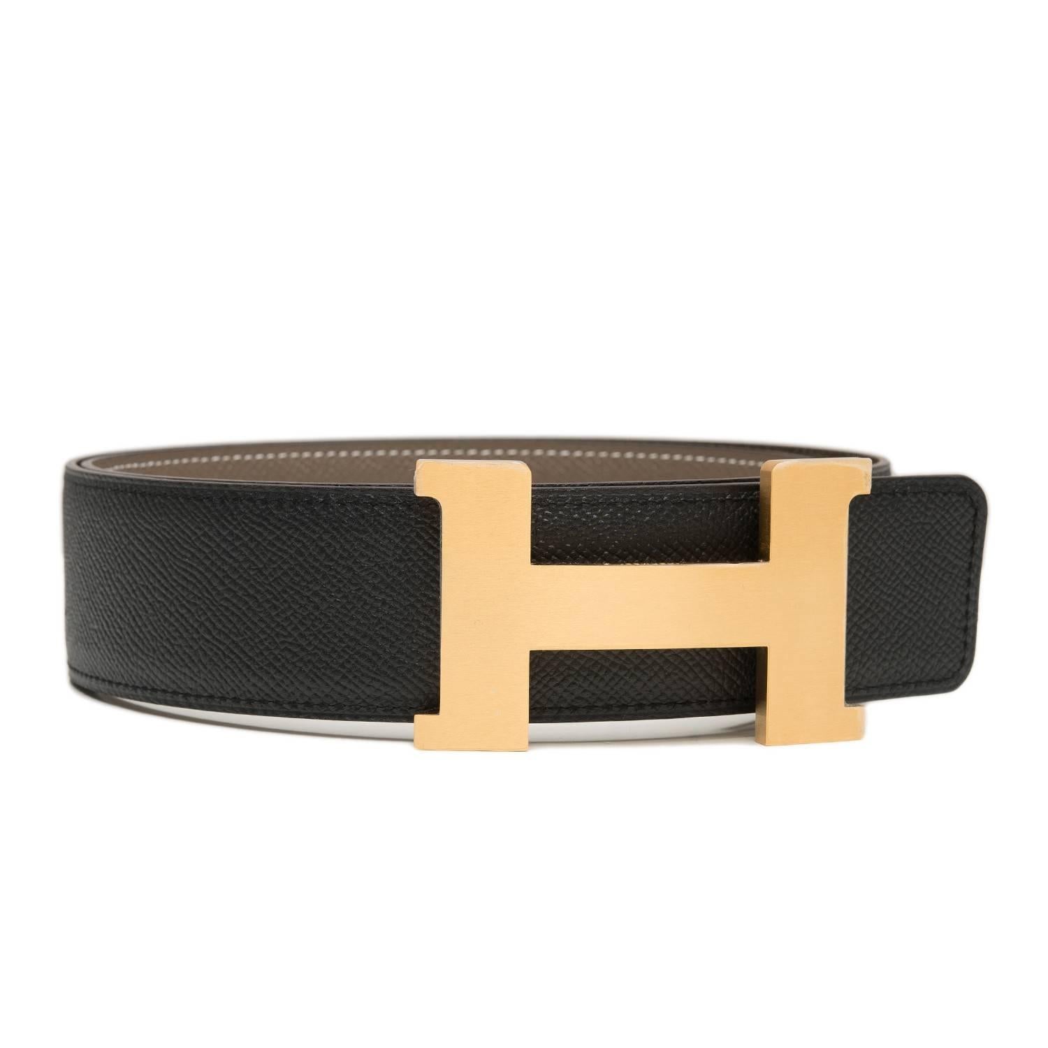 Hermes belt kit comprising an adjustable wide 42mm Constance H belt of etoupe epsom with white contrast stitching reversing to black epsom with tonal stitching and accompanied by a removable gold H buckle. 

Origin: France

Condition: Pristine,