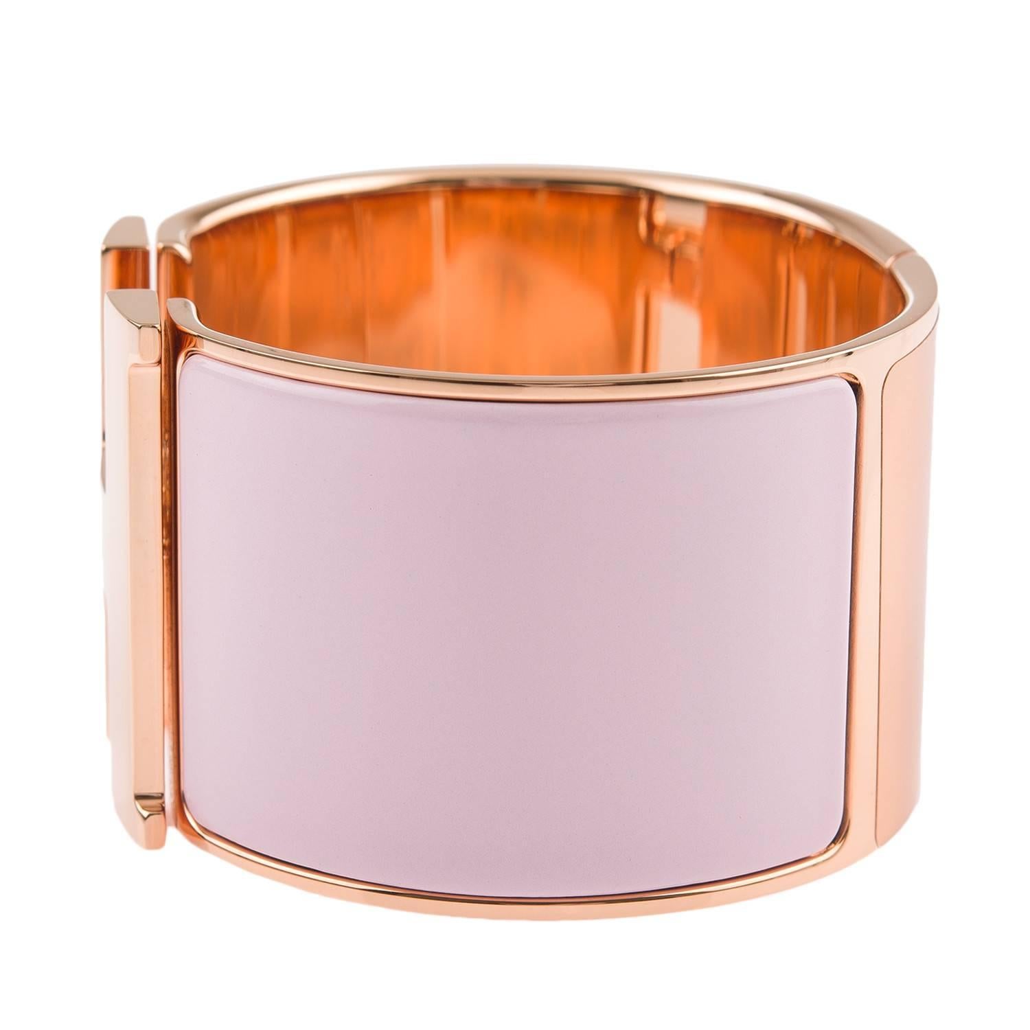 Hermes extra wide Clic Clac H bracelet in rose dragee enamel with gold rose plated hardware in size PM.

Origin: France

Condition: Pristine; never worn and plastic on hardware

Accompanied by: Hermes box, Hermes dustbag, Carebook

Measurements:
