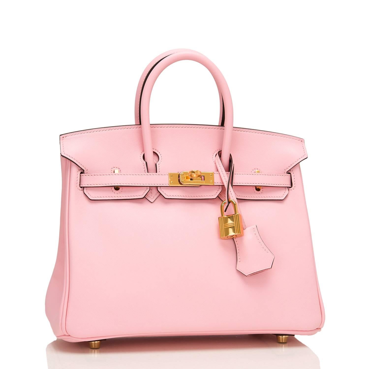 Hermes Rose Sakura Birkin 25cm of swift leather with gold hardware.

This Birkin has tonal stitching, a front toggle closure, a clochette with lock and two keys, and double rolled handles.

The interior is lined with Rose Sakura chevre and has one