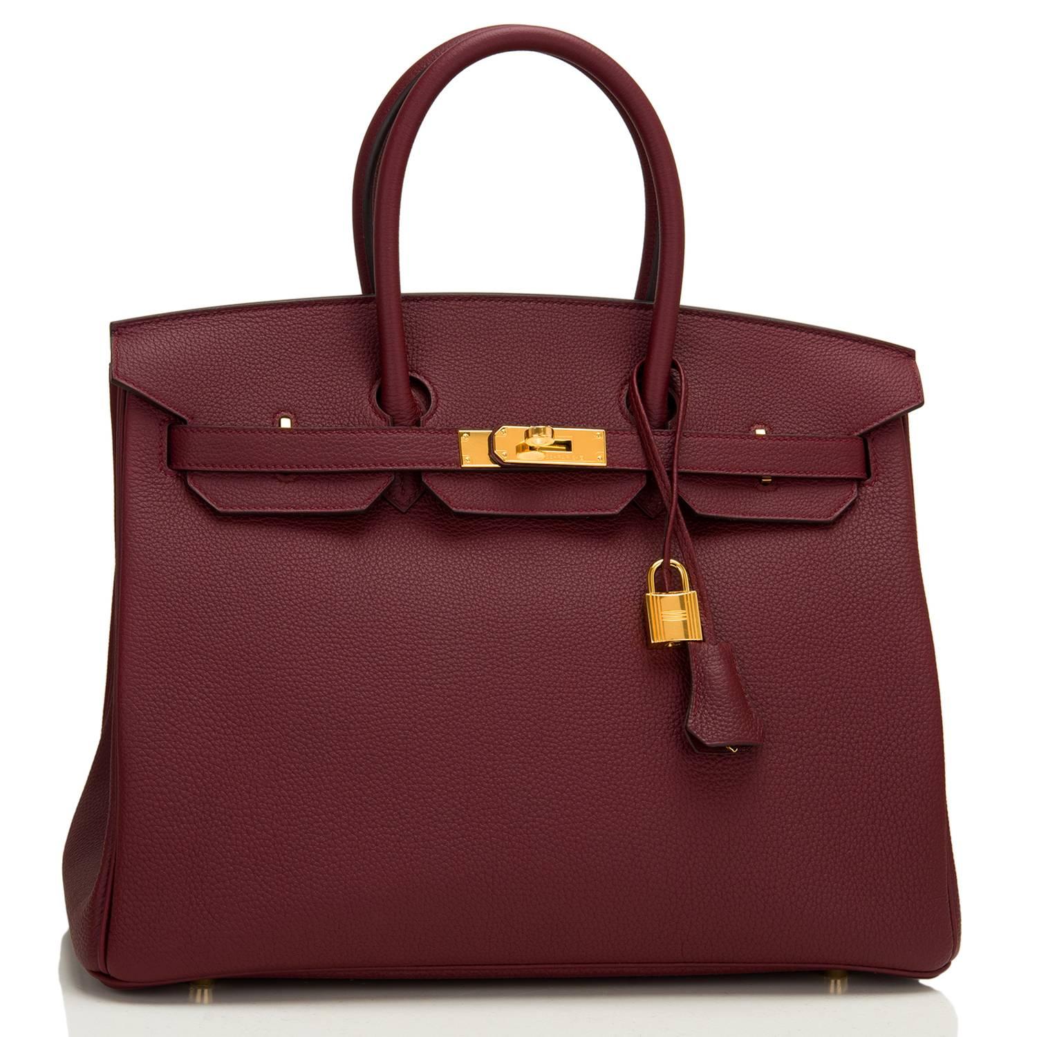 Hermes Bordeaux Birkin 35cm of togo leather and gold hardware.

This Birkin has tonal stitching, a front toggle closure, a clochette with lock and two keys, and double rolled handles.

The interior is lined with Bordeaux chevre and has one zip