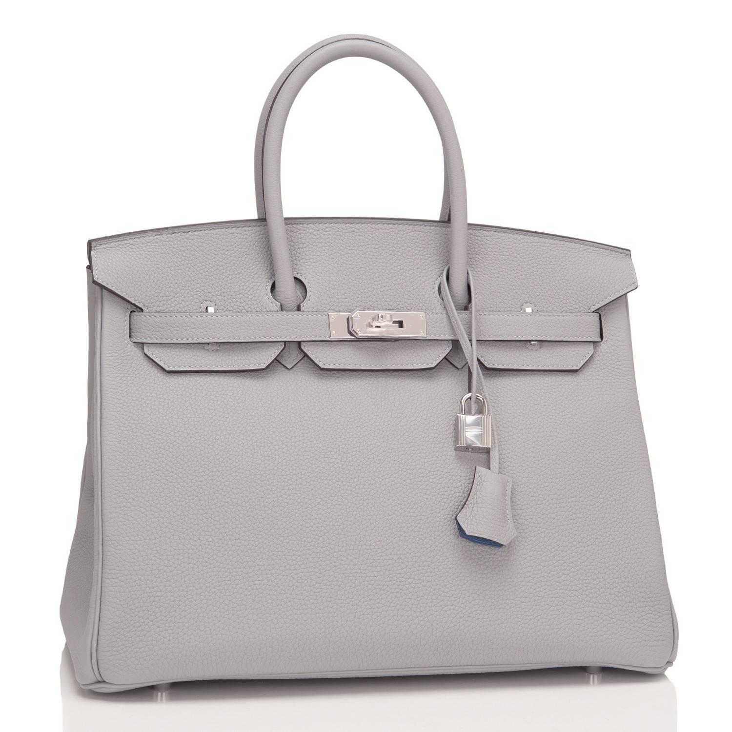 Hermes limited edition Gris Mouette Verso Birkin 35cm of togo leather with blue agate lining and palladium hardware.

This Birkin has tonal stitching, a front toggle closure, a clochette with lock and two keys, and double rolled handles.

The