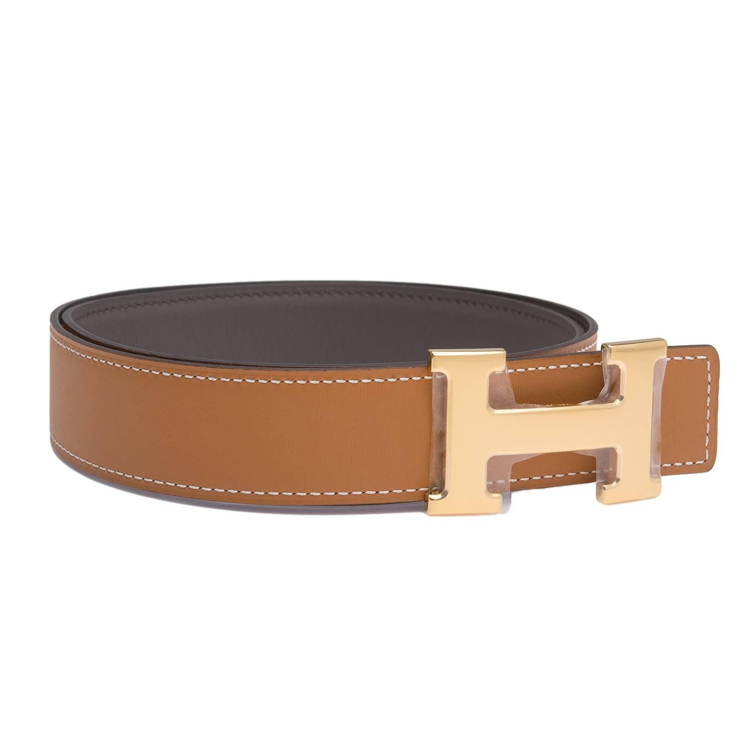 Hermes belt kit comprising an adjustable wide 32mm Constance H belt of Etain charmonix with tonal stitching reversing to Gold charmonix with contrast white stitching accompanied by a removable gold plated H buckle.

Origin: France
 
Condition: