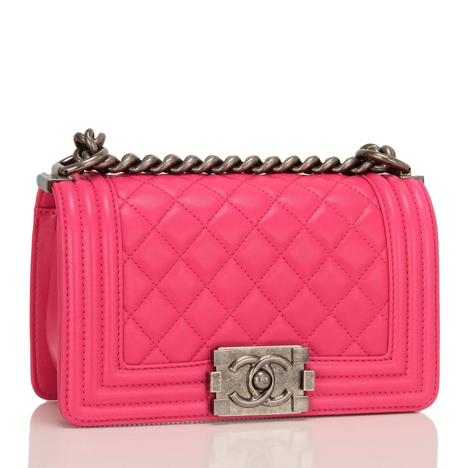 Chanel Small Boy bag of fuchsia pink lambskin leather with aged ruthenium hardware.

This bag features a full front flap with the Boy signature CC push lock closure with an aged ruthenium chain link and fuchsia pink leather padded shoulder/crossbody