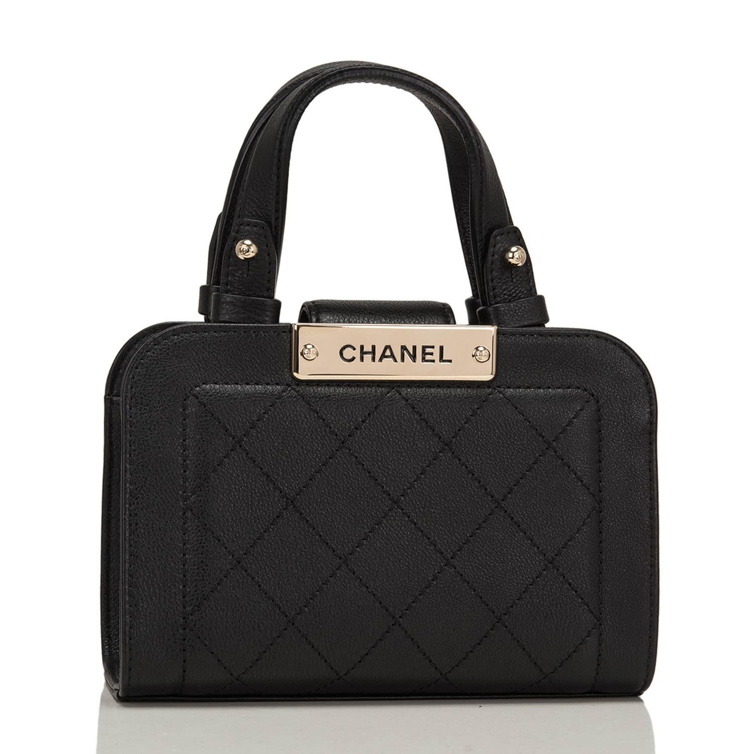 Chanel Small Label Click Shopping bag of quilted and smooth black grained calfskin leather and gold tone hardware.

This limited edition Chanel bag, from the 2017 cruise collection, features a magnetic front closure, double flap top handles, and a