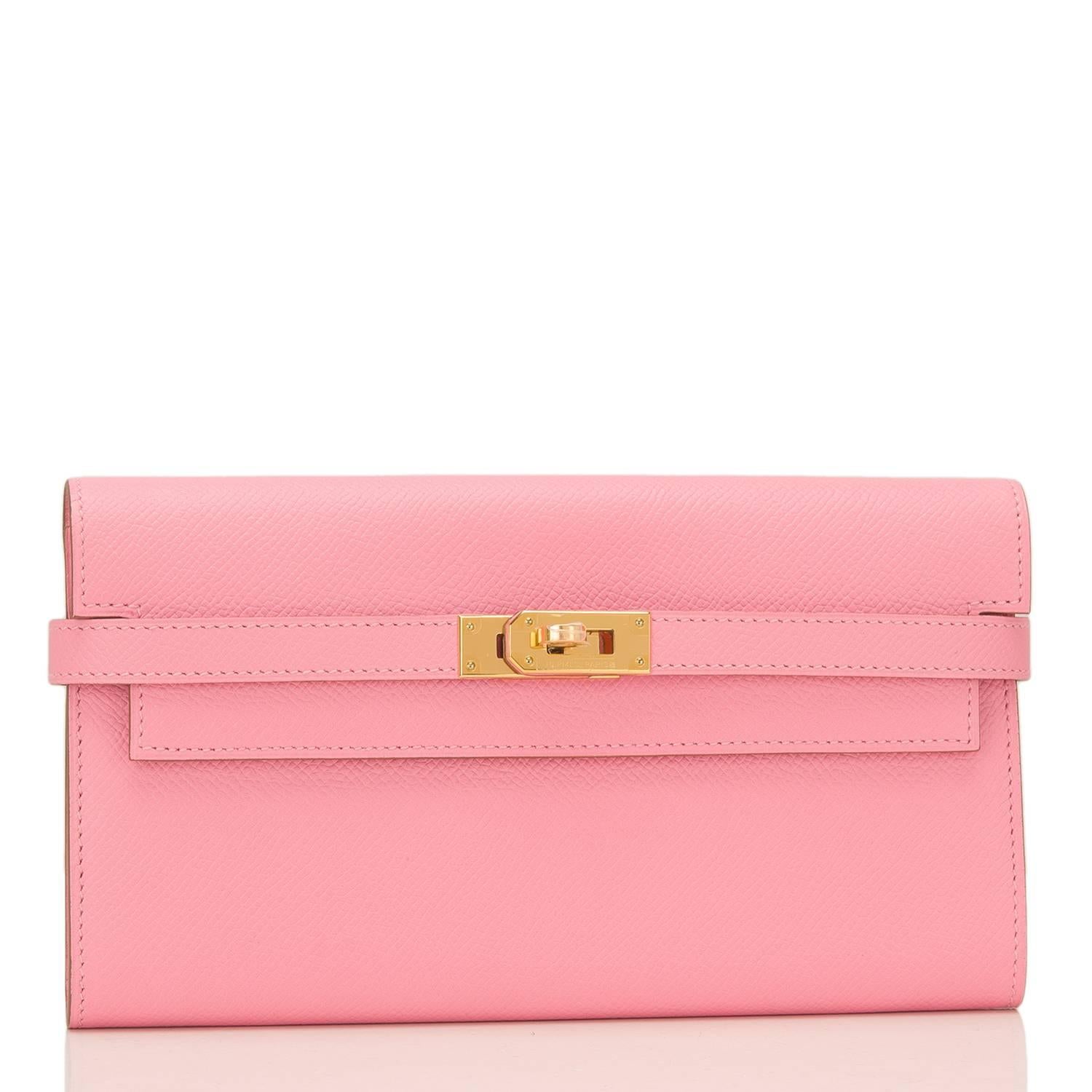 Hermes Rose Confetti Kelly Longue (Long) Wallet of epsom leather with gold hardware.

This Wallet has tonal stitching, gold hardware, and two front straps with a front toggle closure.

The interior is lined with Rose Confetti chevre leather and has