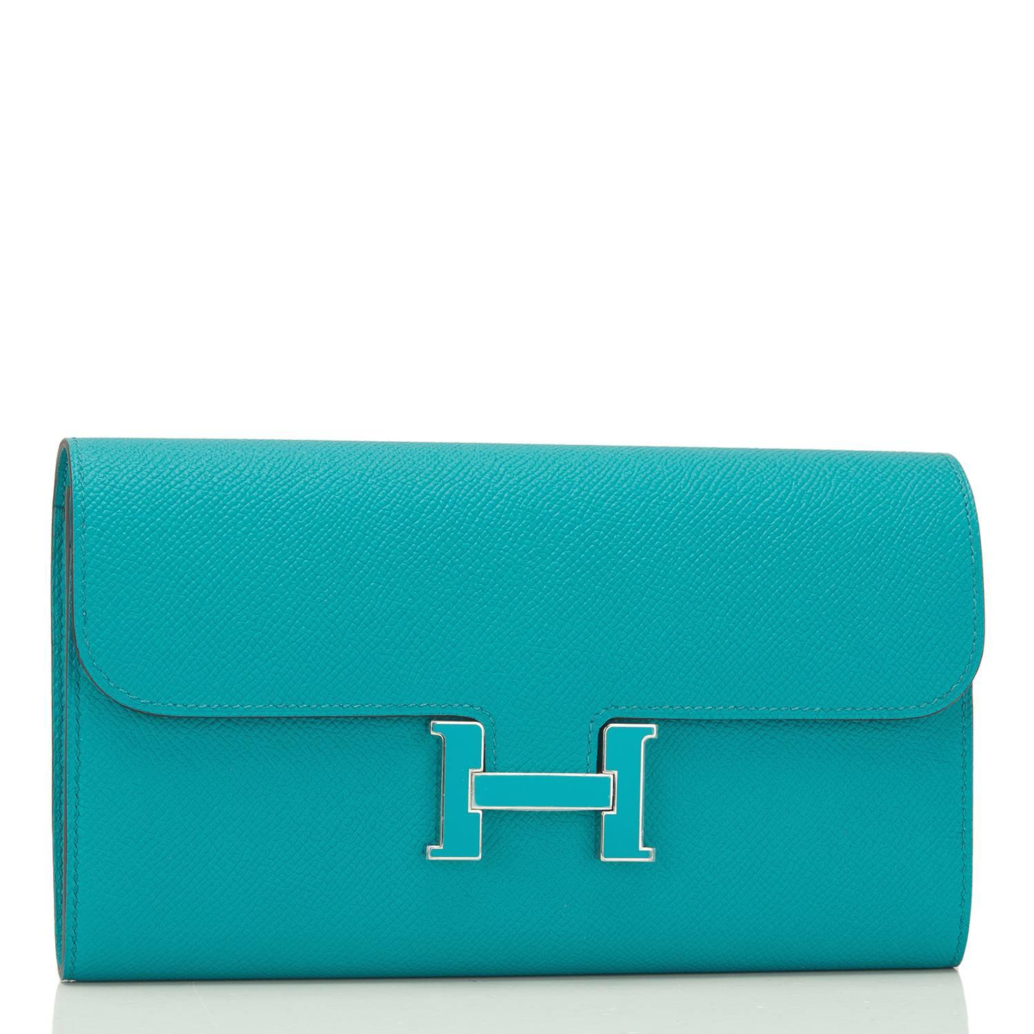 Hermes Blue Paon Constance long wallet/clutch of epsom leather with palladium hardware.

This limited edition wallet, which can also be used as a clutch, has a matching blue paon lacquer 