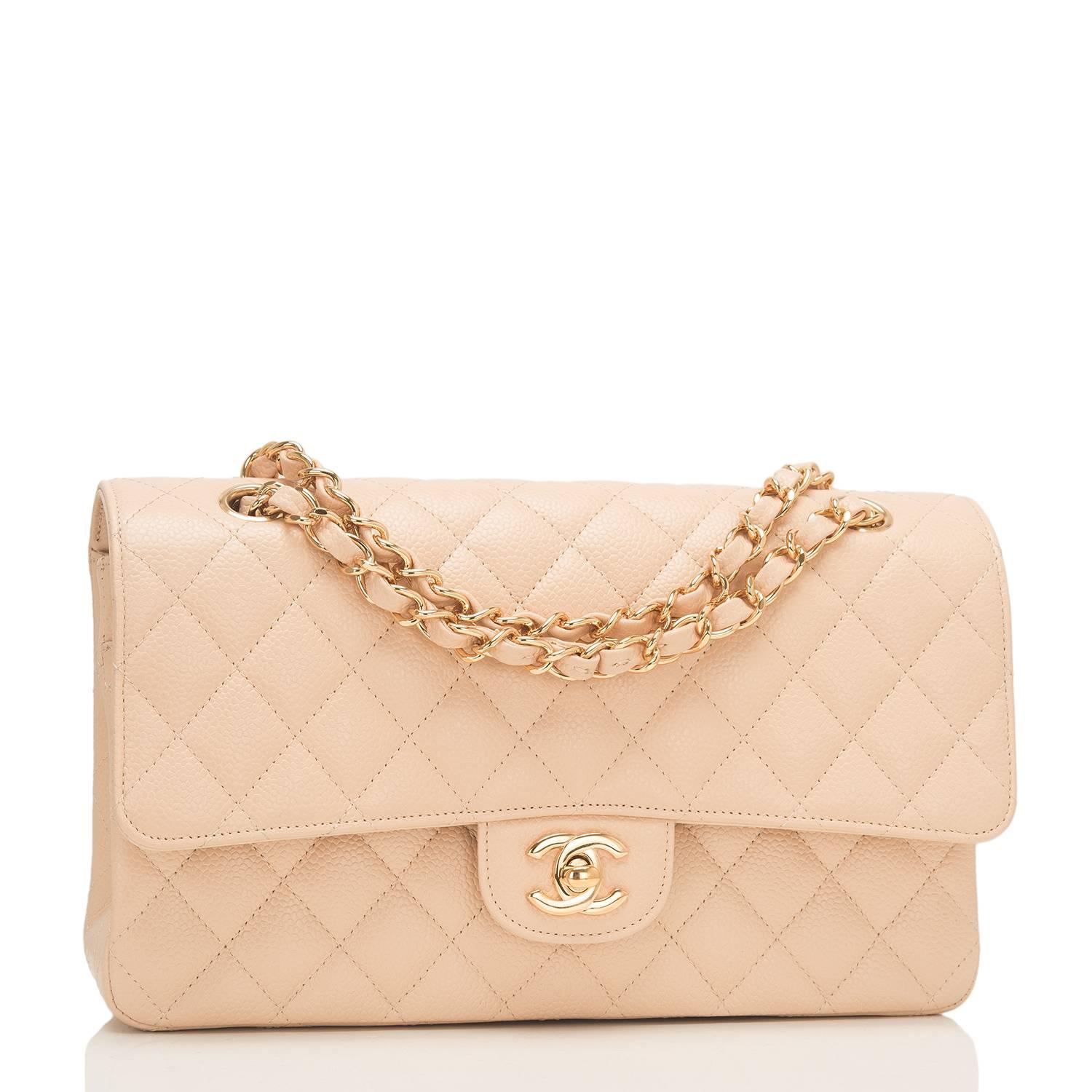 Chanel Medium Classic double flap bag of beige caviar leather with gold tone hardware.

This bag features a front flap with signature CC turnlock closure, a half moon back pocket, and an adjustable interwoven gold tone chain link with beige leather