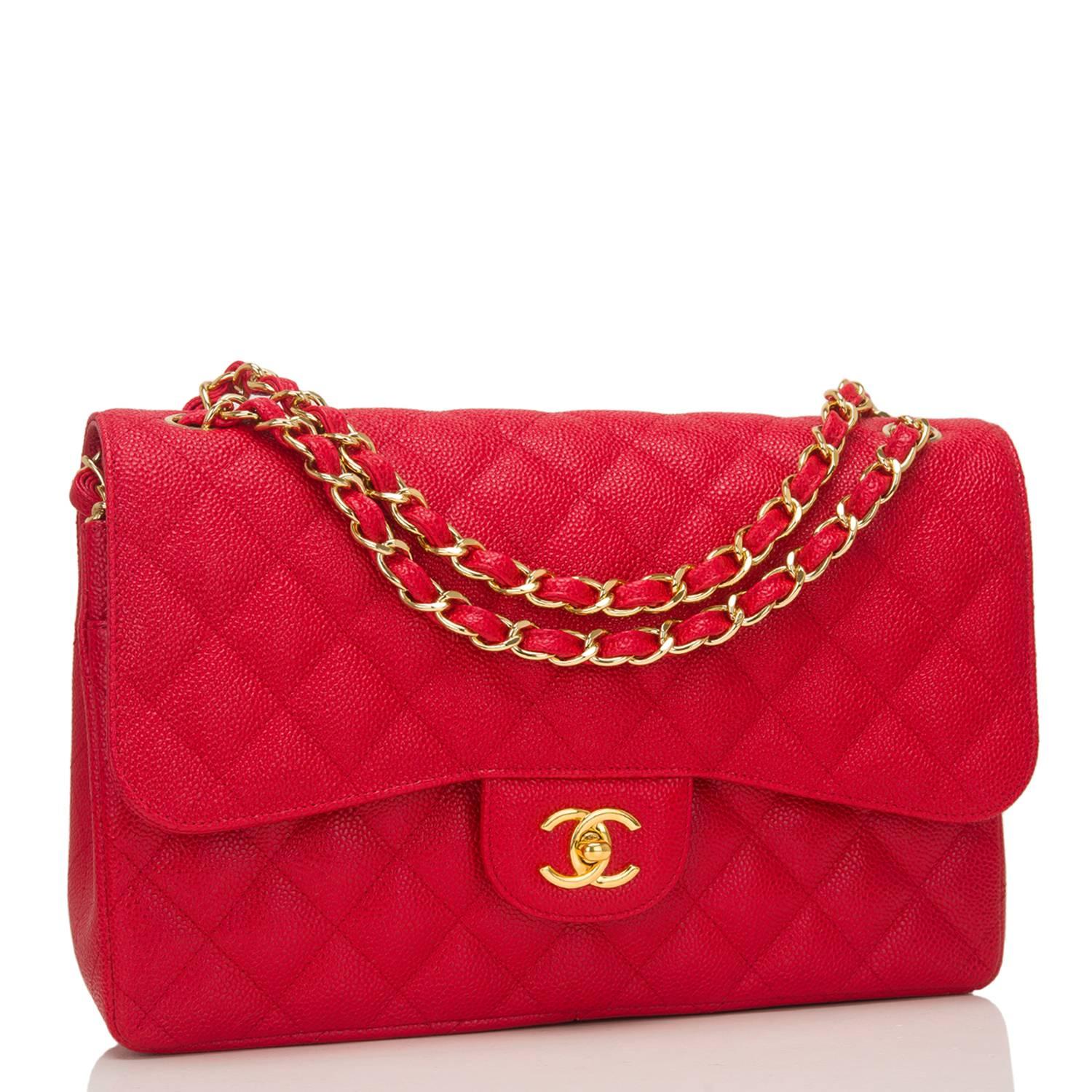 Chanel Jumbo Classic double flap bag of red caviar leather with gold tone hardware.

This bag features a front flap with signature CC turnlock closure, a half moon back pocket, and an adjustable interwoven gold tone chain link and dark red leather
