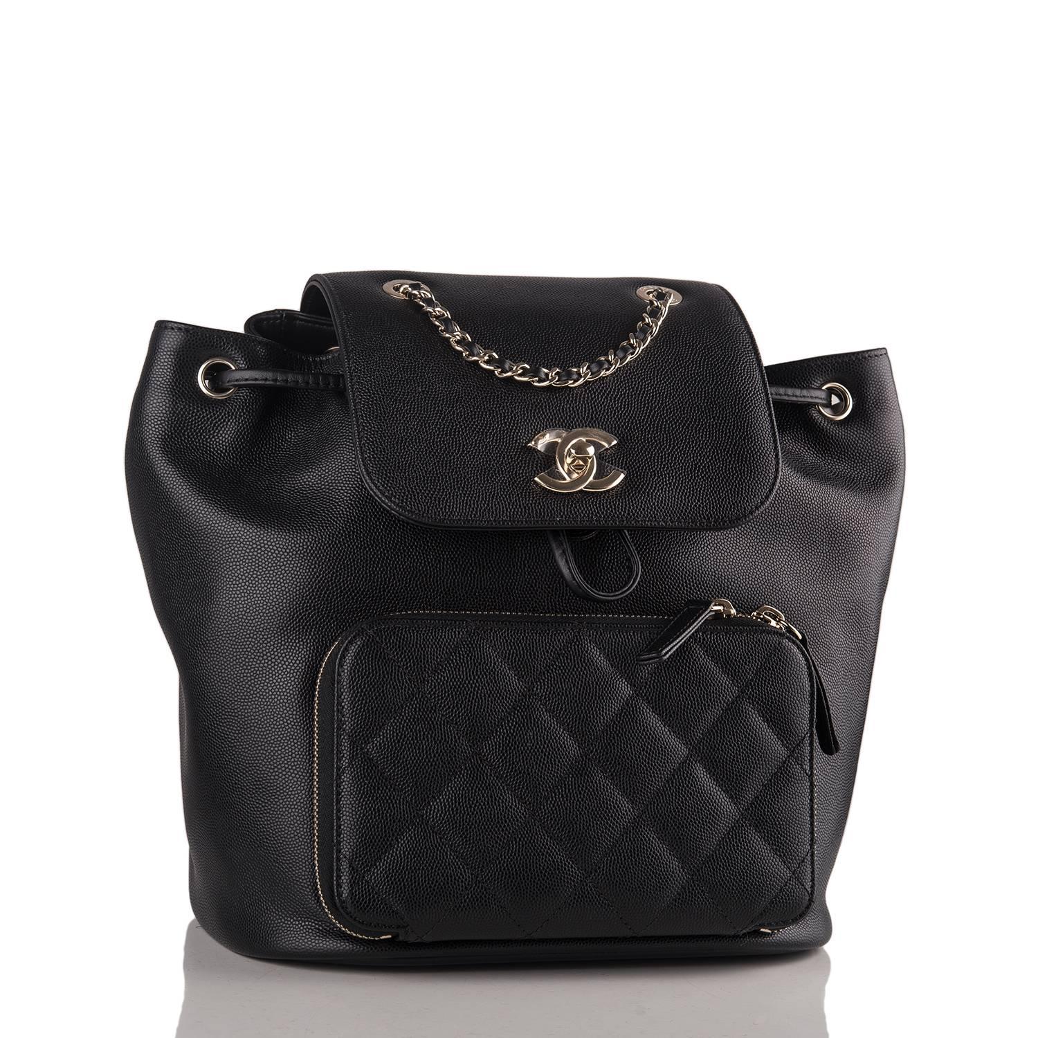 Chanel Business Affinity backpack of black caviar leather with gold tone hardware.

This bag features a front flap with CC turnlock closure, drawstring closure, quilted zip around pocket at front with two leather pulls, quilted halfmoon pocket at