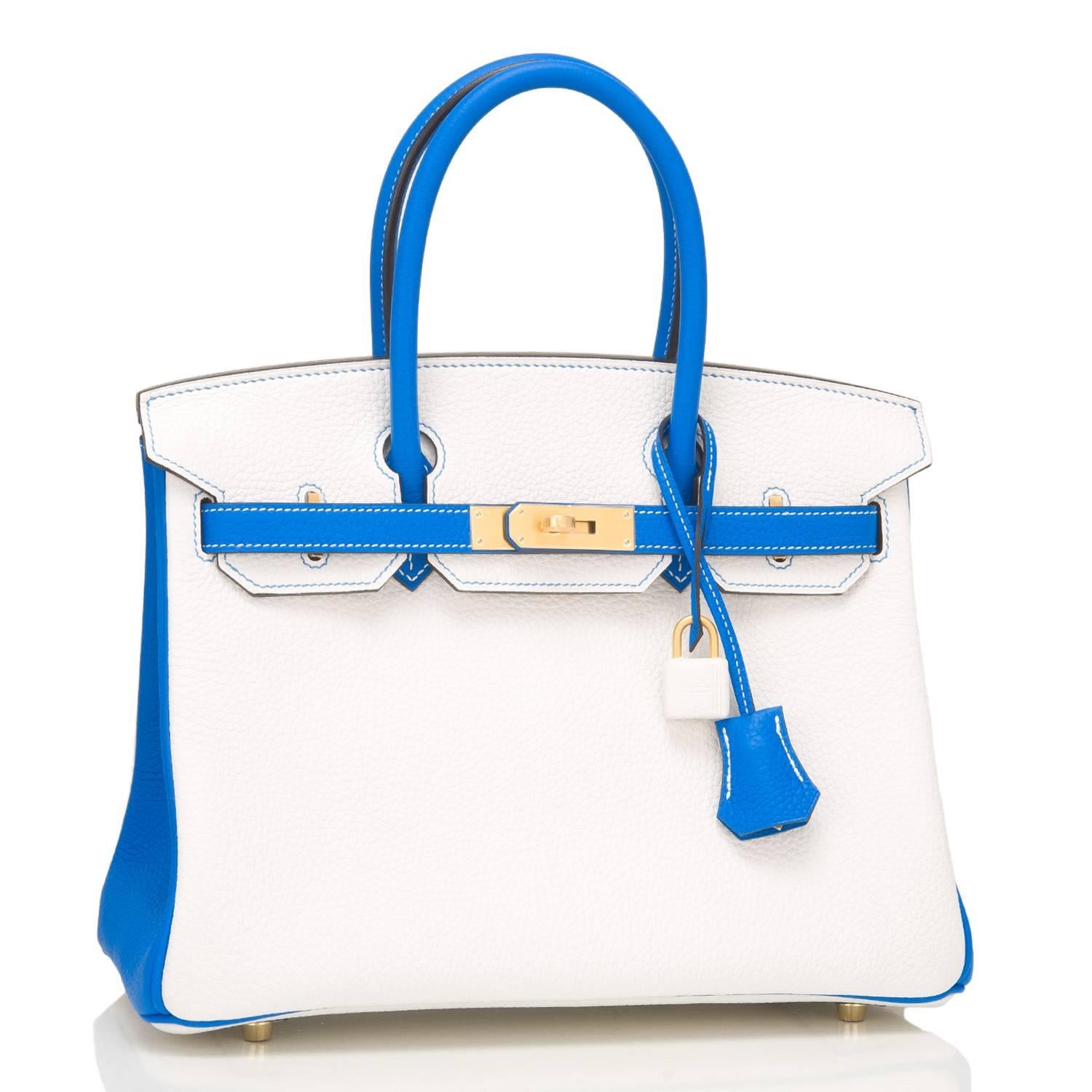 Hermes Horseshoe Stamp (HSS) Birkin 30cm of White and Blue Hydra clemence leather with brushed gold hardware.

This Special Order Birkin has contrasting stitching, a front toggle closure, a clochette with lock and two keys, and double rolled