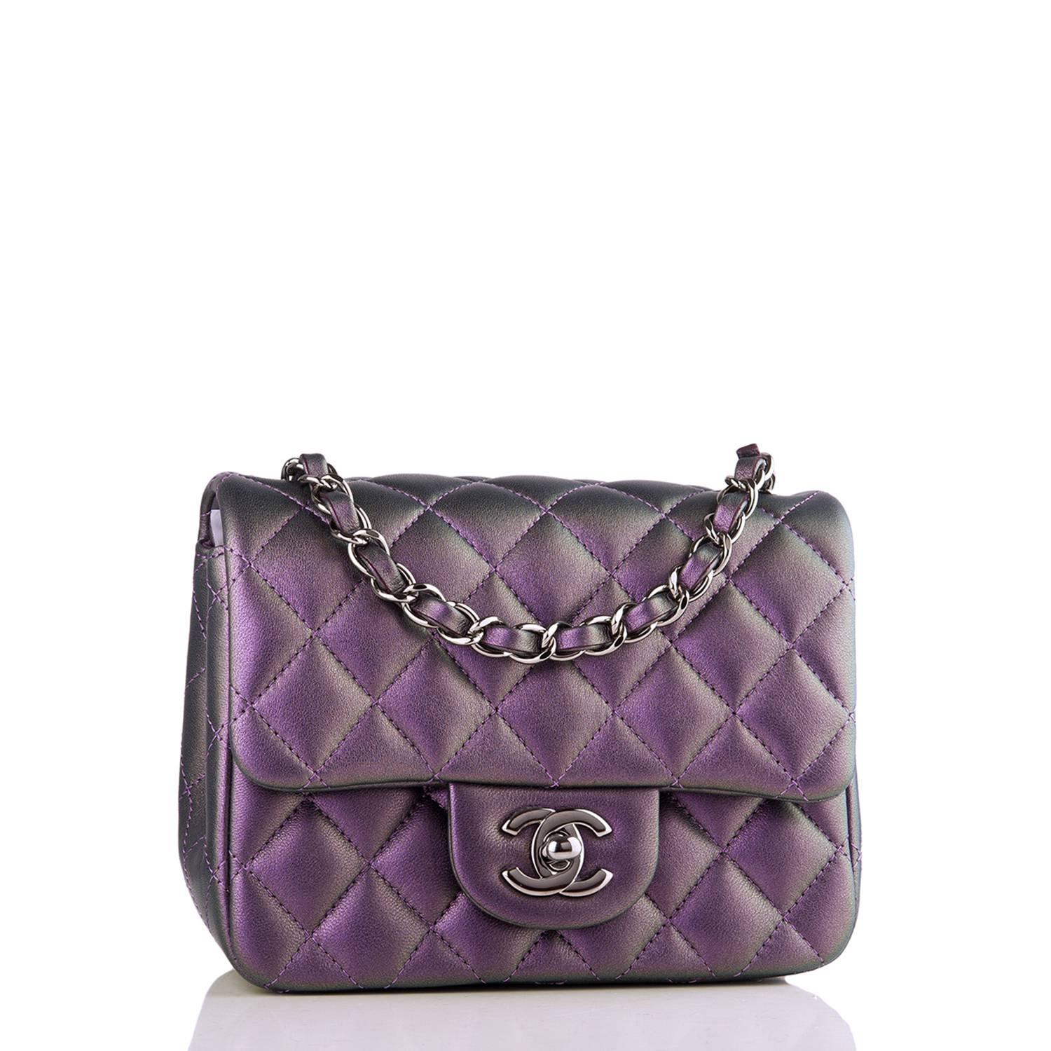 Chanel Square Mini Classic flap bag of Iridescent Purple quilted lambskin leather with ruthenium hardware.

This bag has a front flap with CC turnlock closure, a half moon back pocket, and an interwoven chain link with purple iridescent leather