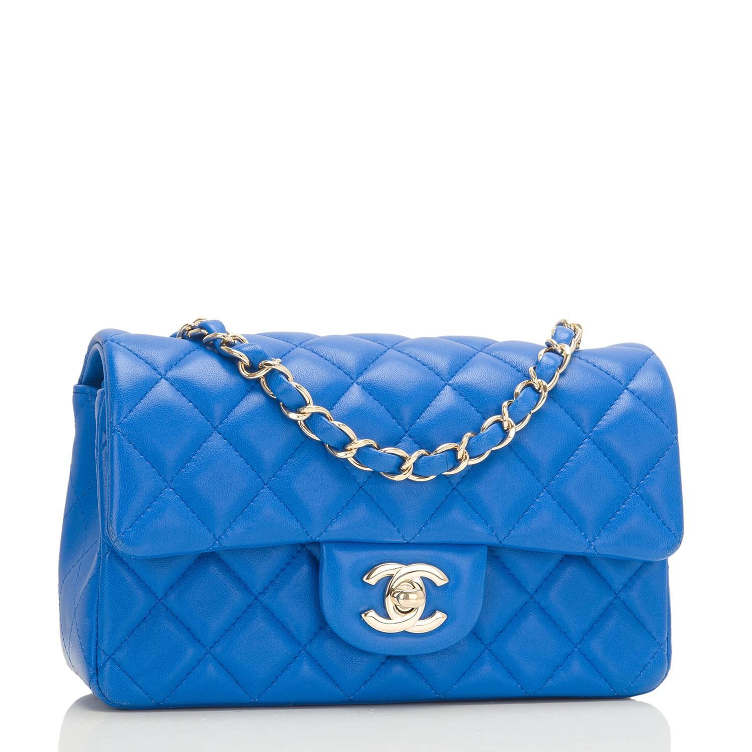 Chanel Rectangular Mini Classic flap bag of blue lambskin with light gold tone hardware.

This bag has a front flap with signature CC turnlock closure, rear half moon pocket and single interwoven blue leather and light gold tone chain link