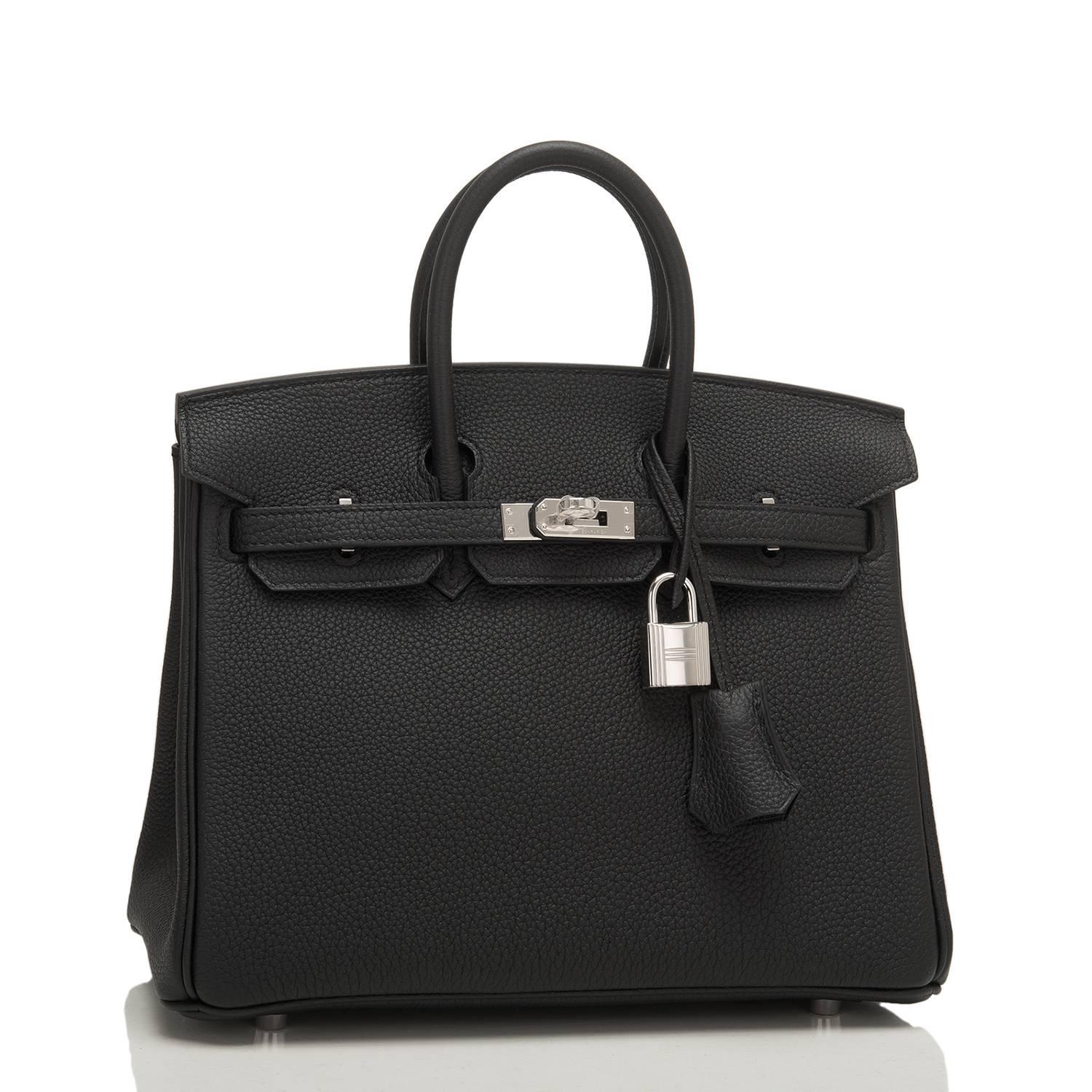 Hermes Black Birkin 25cm of togo leather with palladium hardware.

This Birkin has tonal stitching, a front toggle closure, a clochette with lock and two keys, and double rolled handles.

The interior is lined with black chevre and has a zip pocket