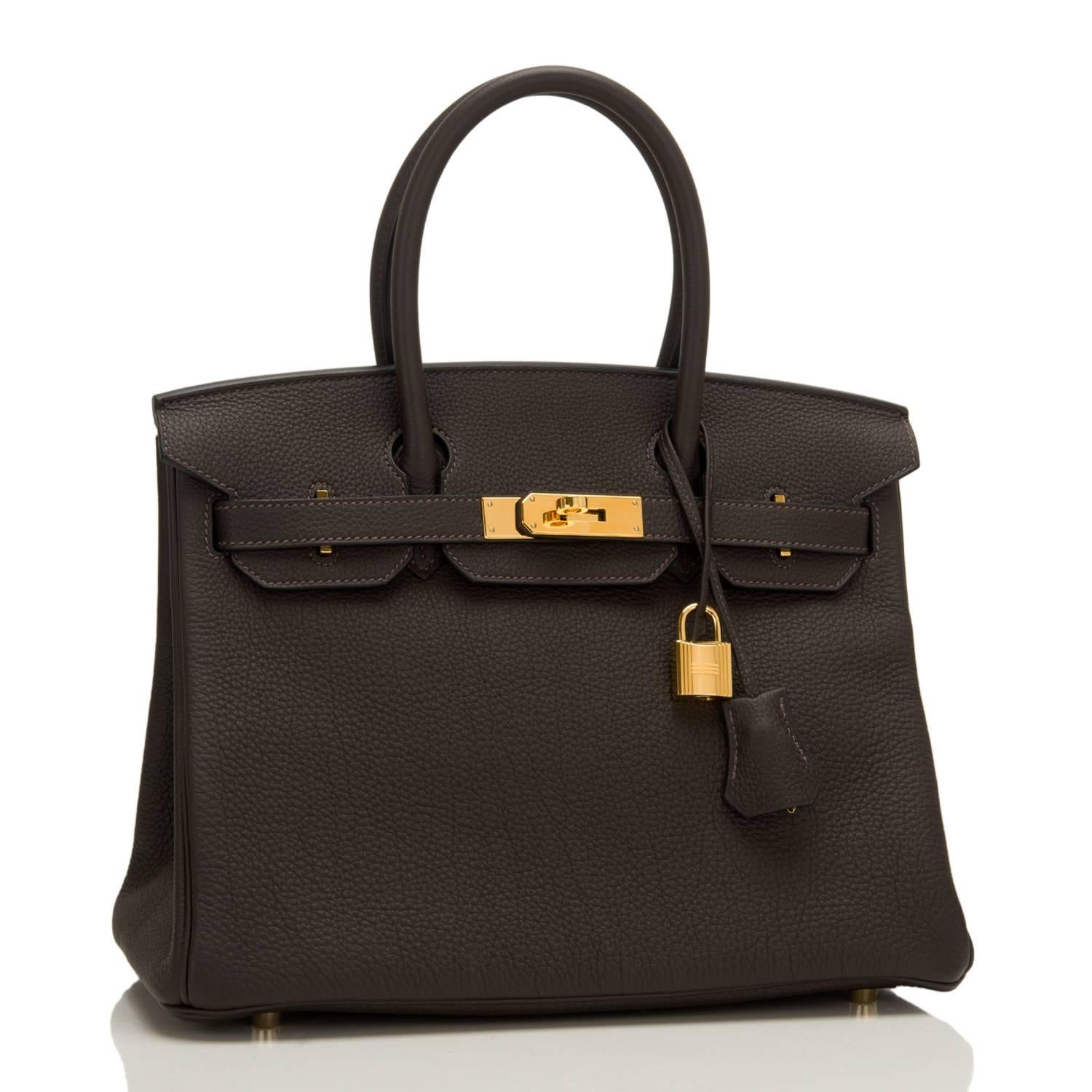 Hermes Macassar (Ebony) Birkin 30cm of Togo leather with gold hardware.

This Birkin has tonal stitching, a front toggle closure, a clochette with lock and two keys, and double rolled handles.

The interior is lined with Macassar chevre and has one