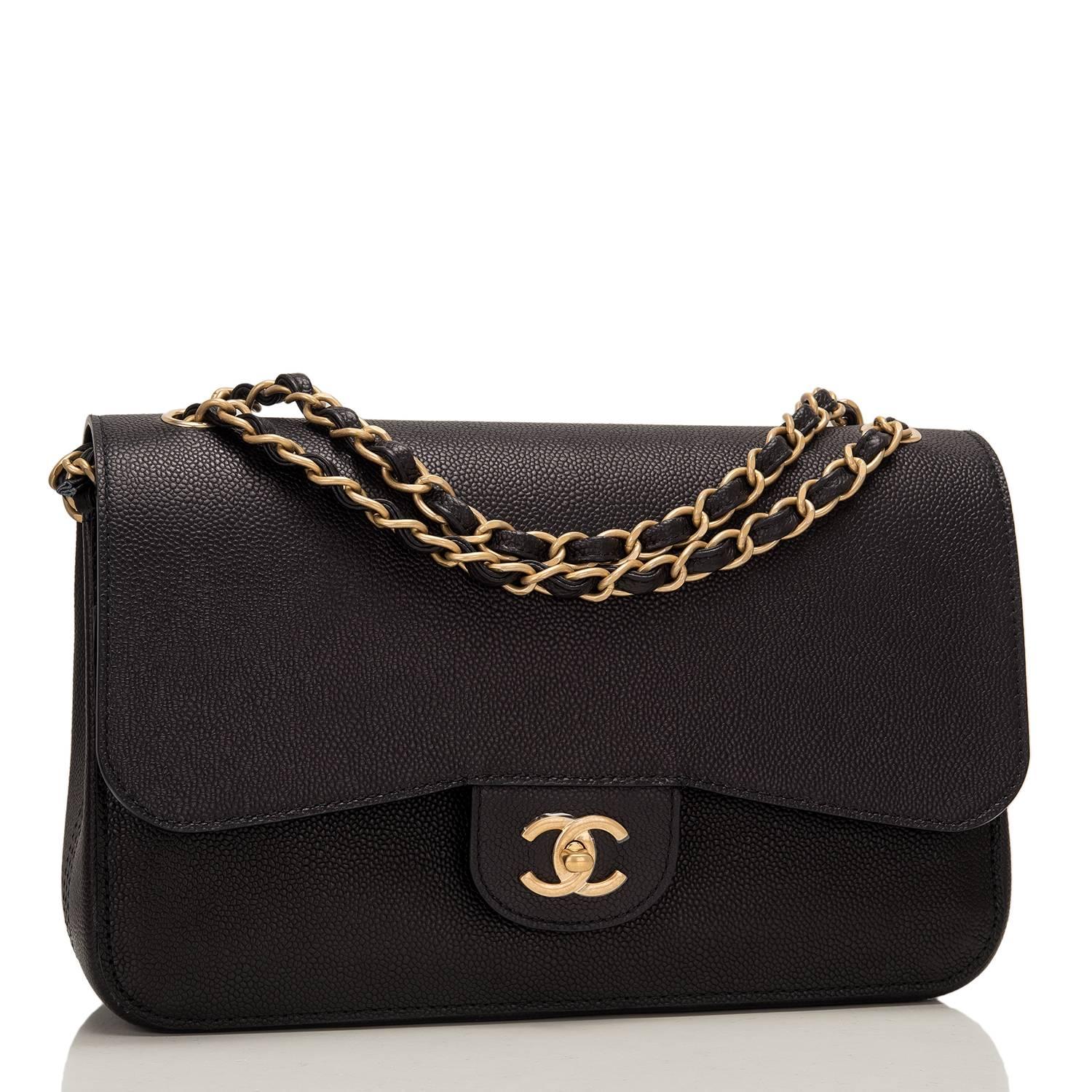Chanel Jumbo Classic double flap bag of black caviar leather and accented with gold tone hardware.

The bag features a front flap with signature CC turnlock closure, a half moon back pocket, and an adjustable interwoven gold tone chain link and
