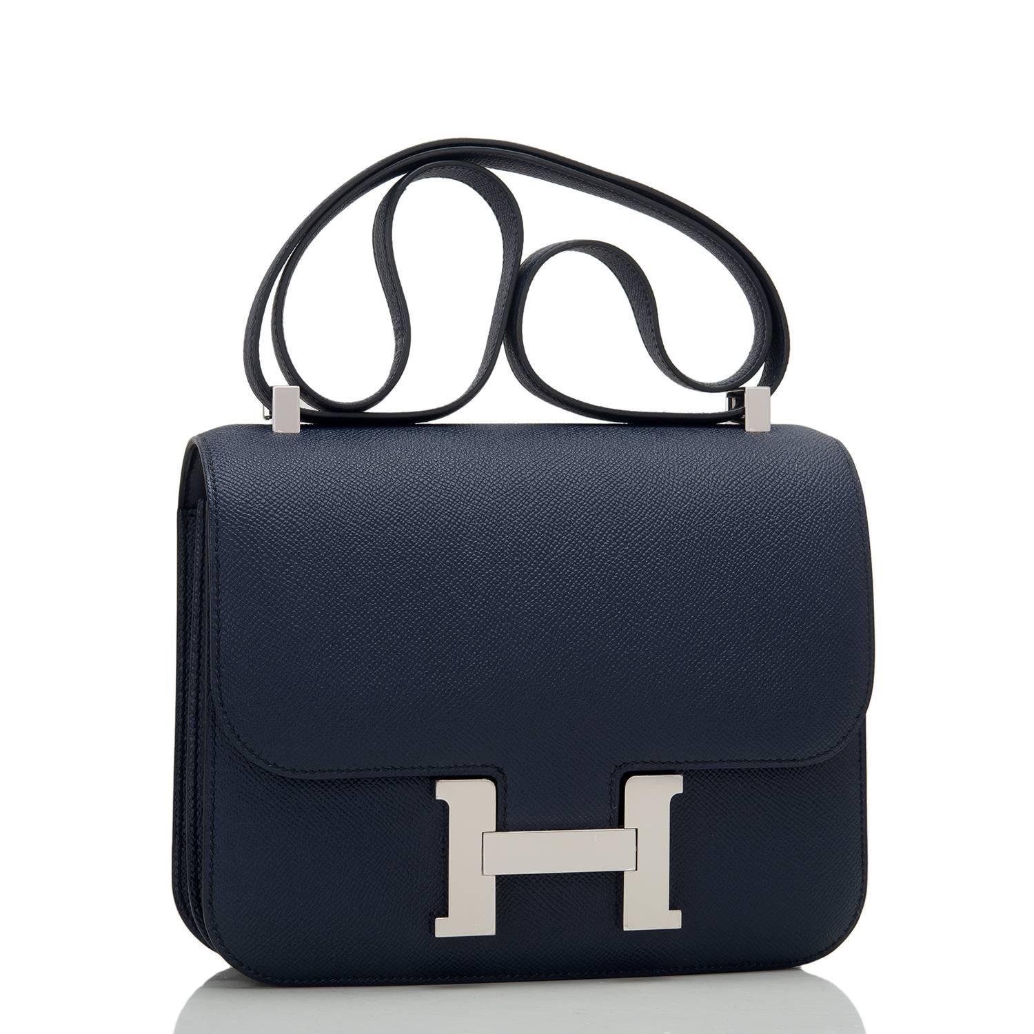 Hermes Indigo Constance 24cm of epsom leather with palladium hardware.

This Constance has tonal stitching, a metal 