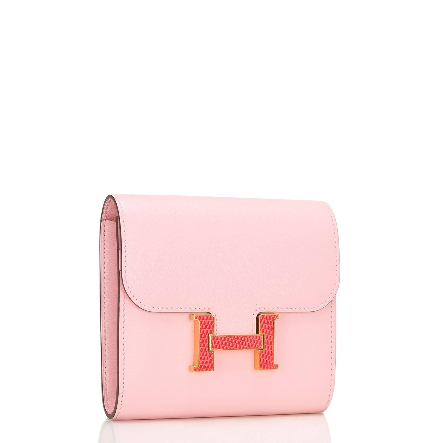 Hermes Rose Sakura tadelakt leather Constance Compact Wallet with a Bougainvillea lizard H and gold hardware.

This compact wallet has tonal stitching, a Bougainvillea lizard 