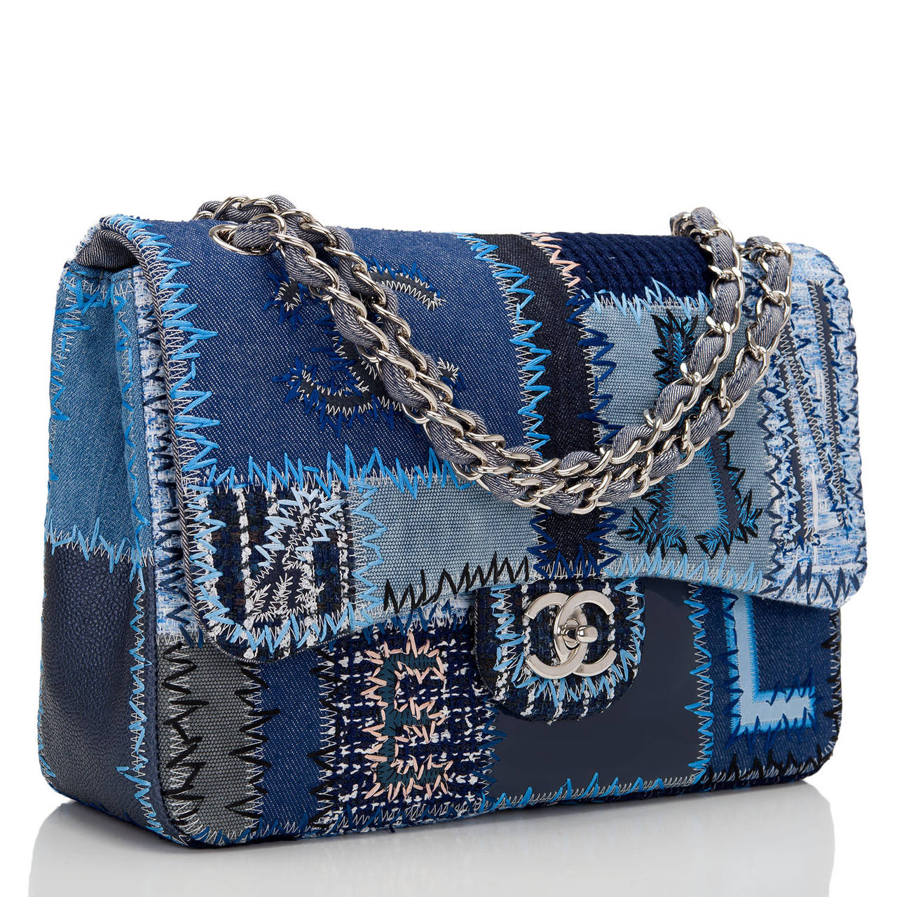 This Patchwork Jumbo Classic flap bag is unique in construction and design. An instant success, the funky and casual styling actual is a masterpiece of workmanship, incorporating numerous denim fabrics, boucle, and colors in a classic style with the