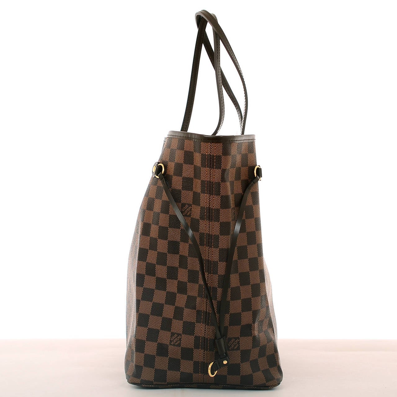 Louis Vuitton dark and light brown checkered Damier Ebene Neverfull GM of coated canvas with smooth brown leather trim.

This classic tote features polished brass hardware, adjustable drawstring sides, hidden top hook closure and double flat