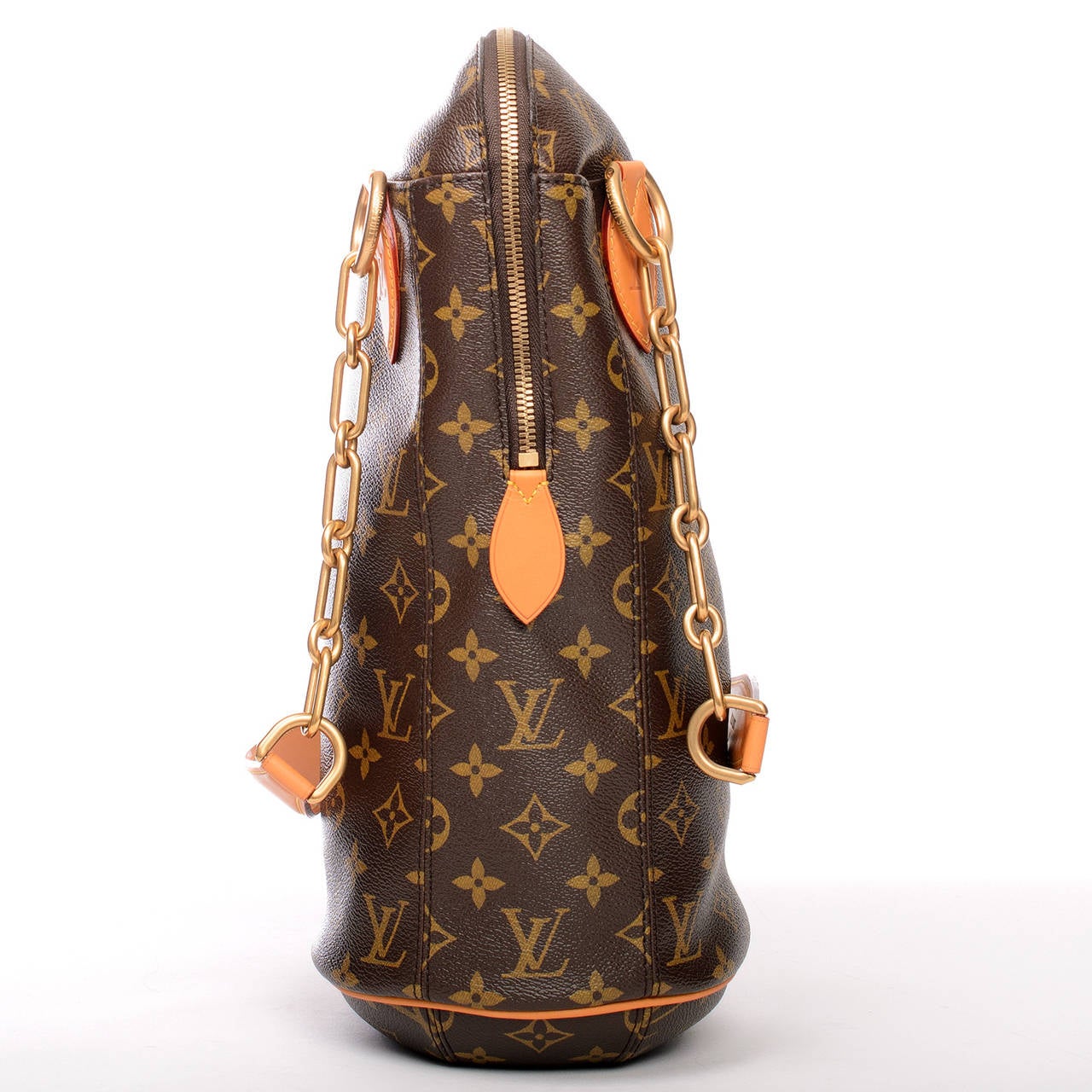 Louis Vuitton Monogram Iconoclasts Punching Bag BB designed by Karl Lagerfeld.

This chic punching bag features coated canvas with tanned vachetta leather trim, aged brass hardware, top zipper closure, and double chain link straps with leather