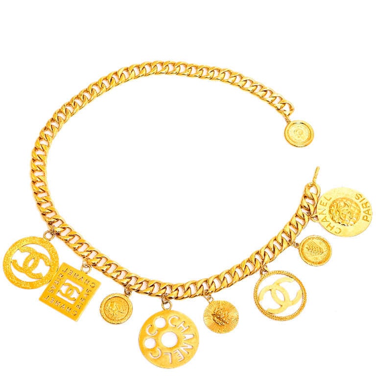 Chanel vintage goldtone chain link adjustable belt/necklace with 8 oversized charms including: iconic CC's, quilted prints, wheat, elephants, COCO CHANEL PARIS, and sunburst pattern coins. 

This stunningly beautiful CC belt has been featured in