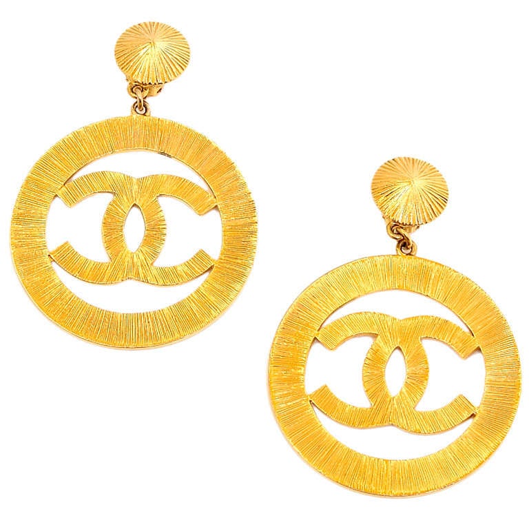 Chanel vintage goldtone sunburst textured CC icon hoop earrings

These glamourous CC earrings have been featured in the pages of Elle and Numero (with Madison Avenue Couture credited for the piece).

Origin: France

Collection: Stamped Chanel