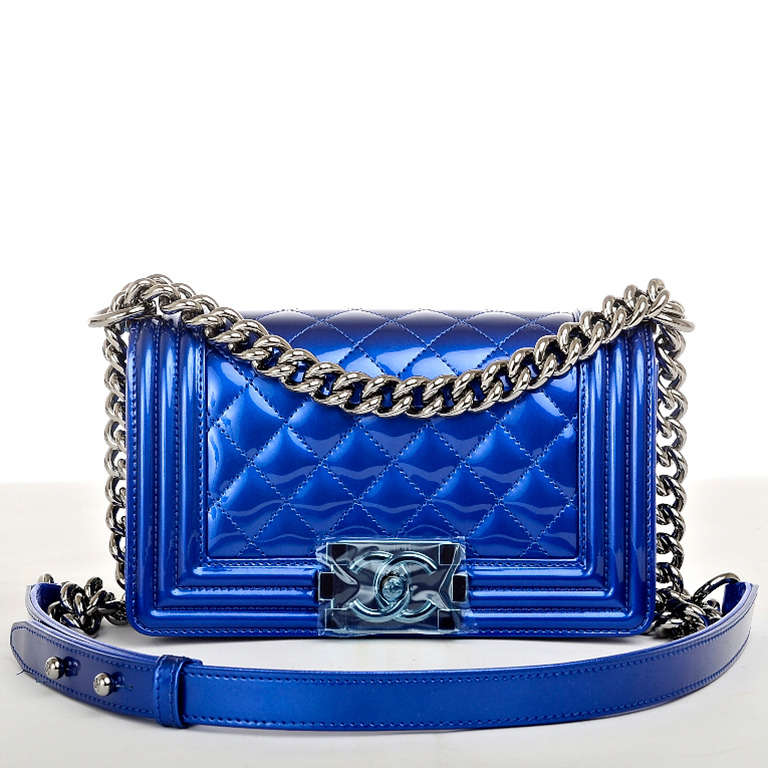 Chanel metallic blue quilted patent leather Small Boy Bag with ruthenium hardware, metallic blue lambskin gussets and bottom, front flap with CC push lock closure and ruthenium chain link and blue leather padded shoulder strap. Interior is lined in