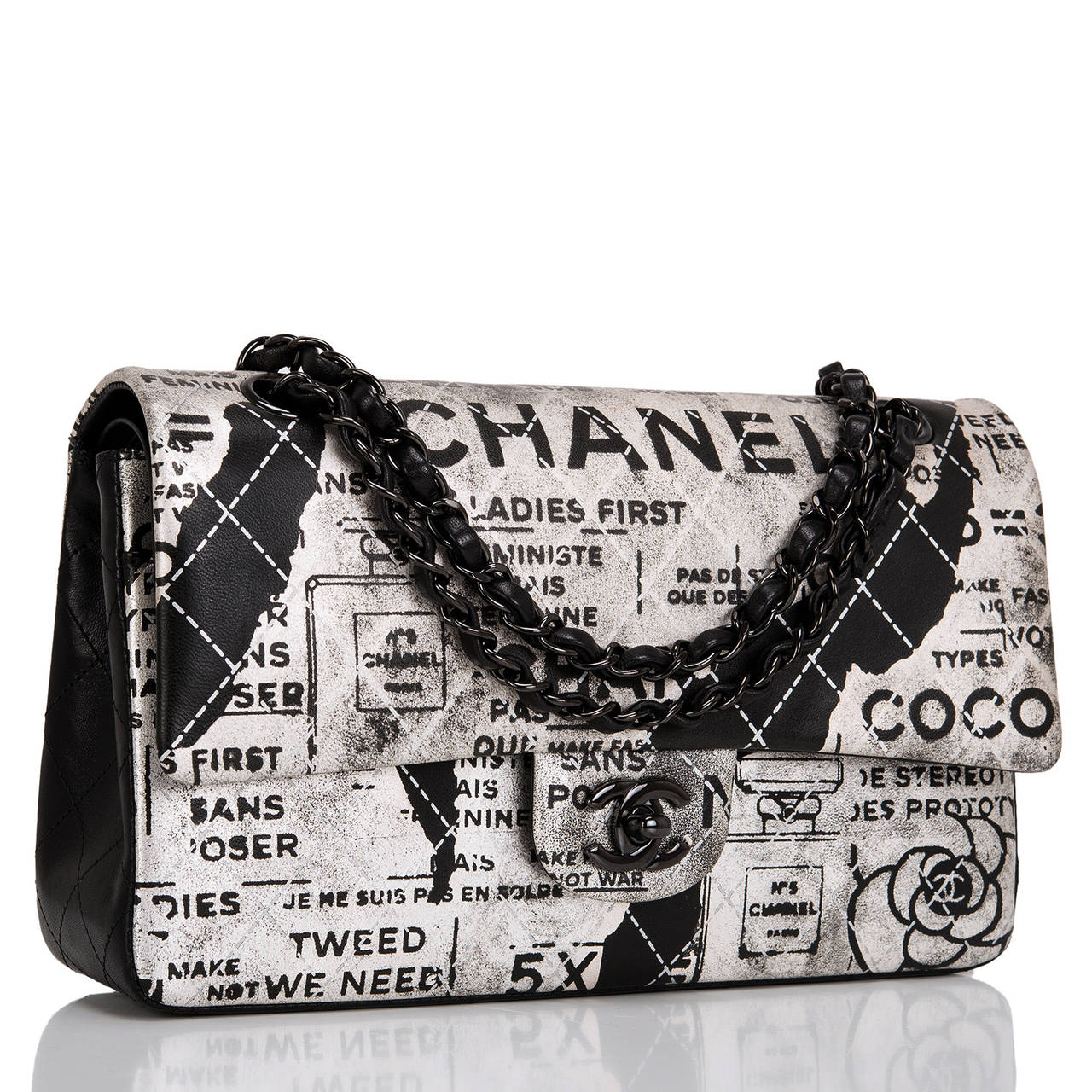 This limited edition Chanel Large Classic double flap features hand-painted black lambskin with silver painted detail. The bag features a front flap with signature black metal CC turnlock closure, half moon back pocket and an adjustable interwoven